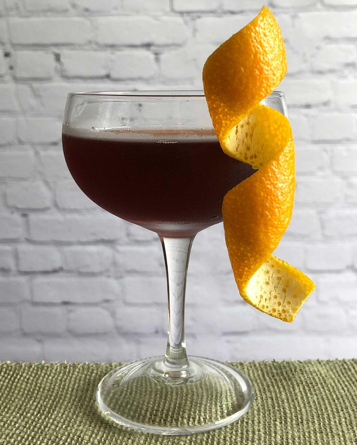 An example of the Cliffhanger, the mixed drink (drink) featuring Dolin Dry Vermouth de Chambéry, Banyuls, and orange twist; photo by Lee Edwards