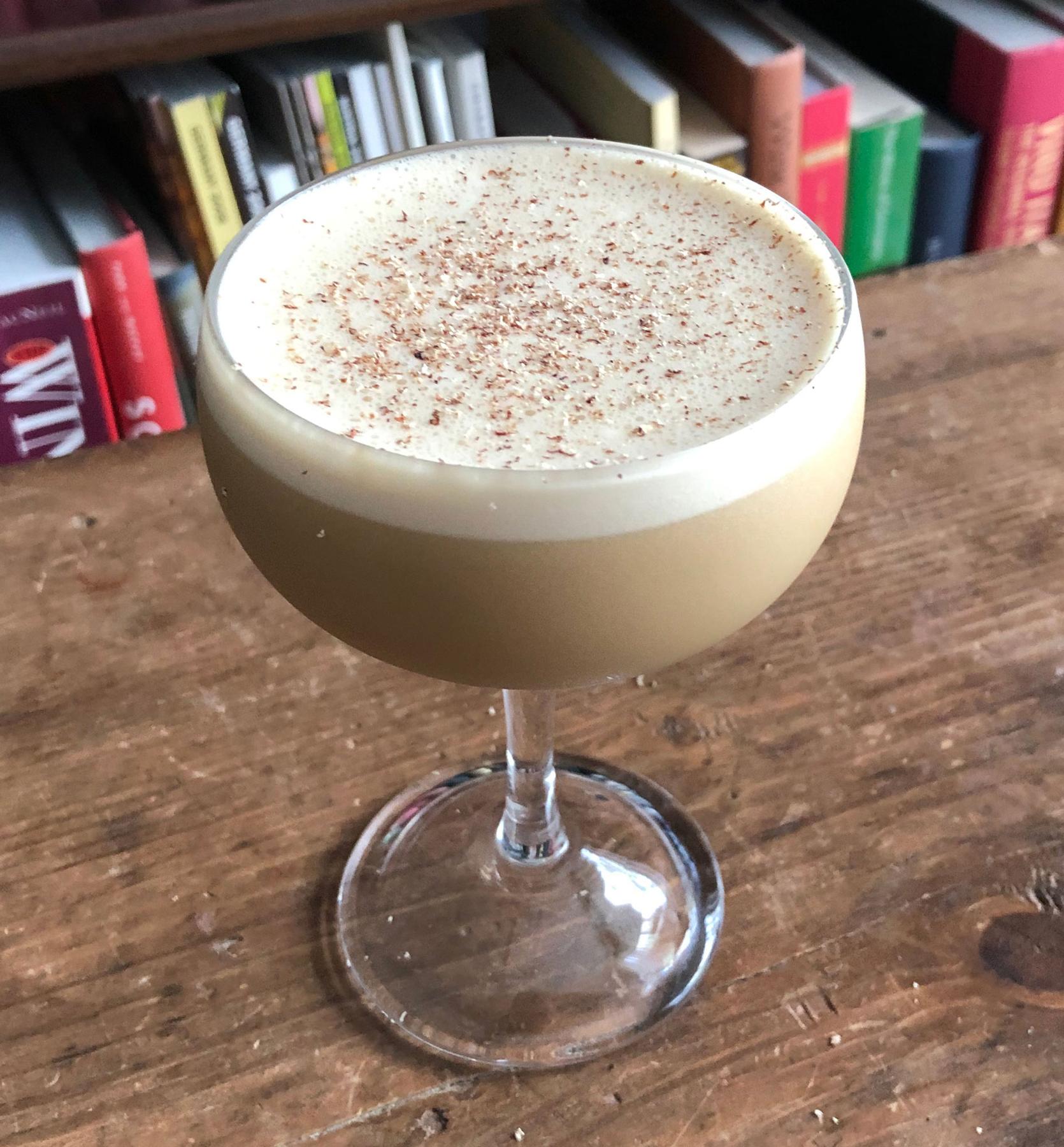 An example of the Alpine Flip, the mixed drink (drink) featuring raw egg, Nux Alpina Walnut Liqueur, The Scarlet Ibis Trinidad Rum, cream, John D. Taylor’s Velvet Falernum, and grated nutmeg; photo by Lee Edwards