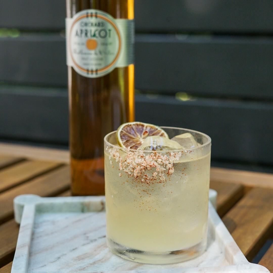 An example of the Ultimate Apricot Margarita, the mixed drink (drink) featuring blanco tequila, Rothman & Winter Orchard Apricot Liqueur, lime juice, and salt; photo by Madison Young