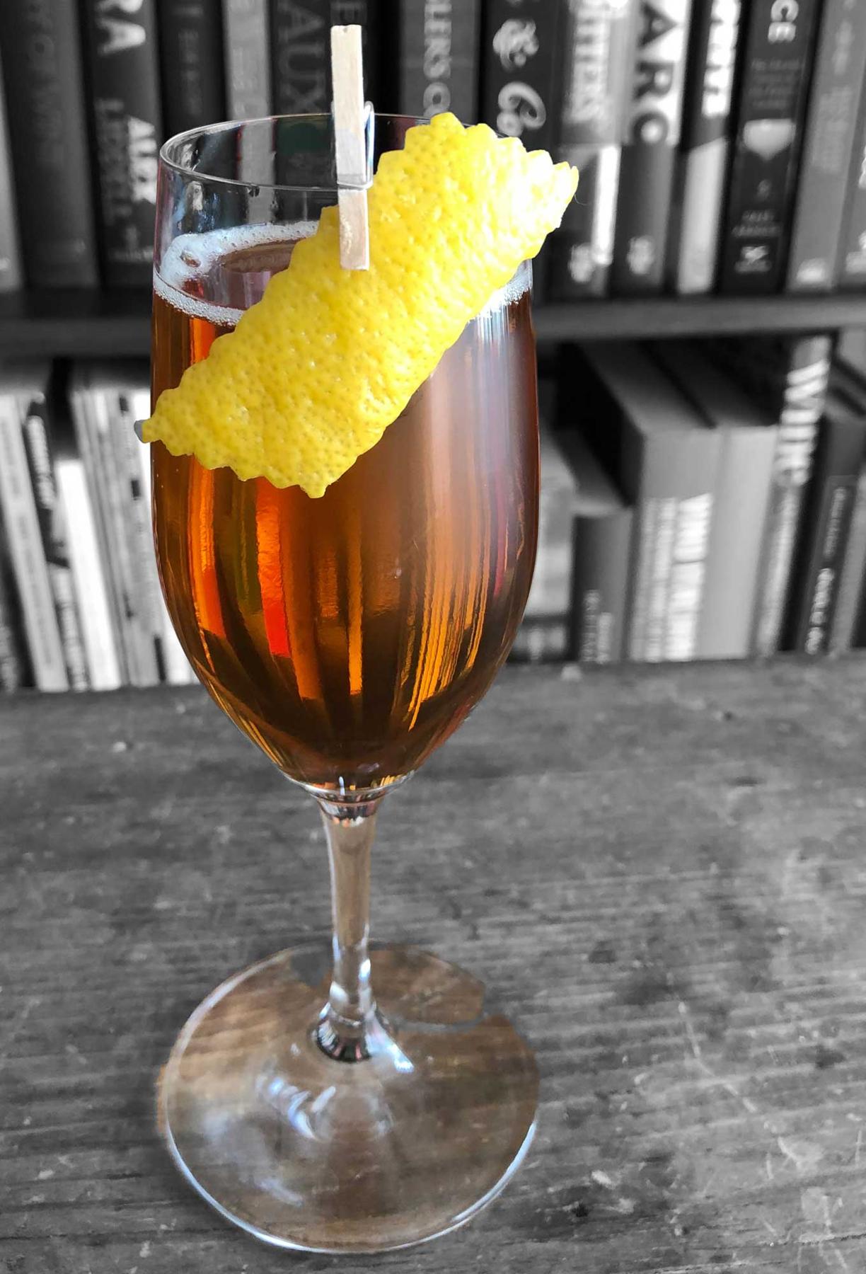 An example of the Daisy Buchanan, the mixed drink (drink), by Andrew Hotis, Heirloom, New Haven, CT, featuring sparkling wine, calvados, Rothman & Winter Orchard Pear Liqueur, and lemon twist; photo by Lee Edwards