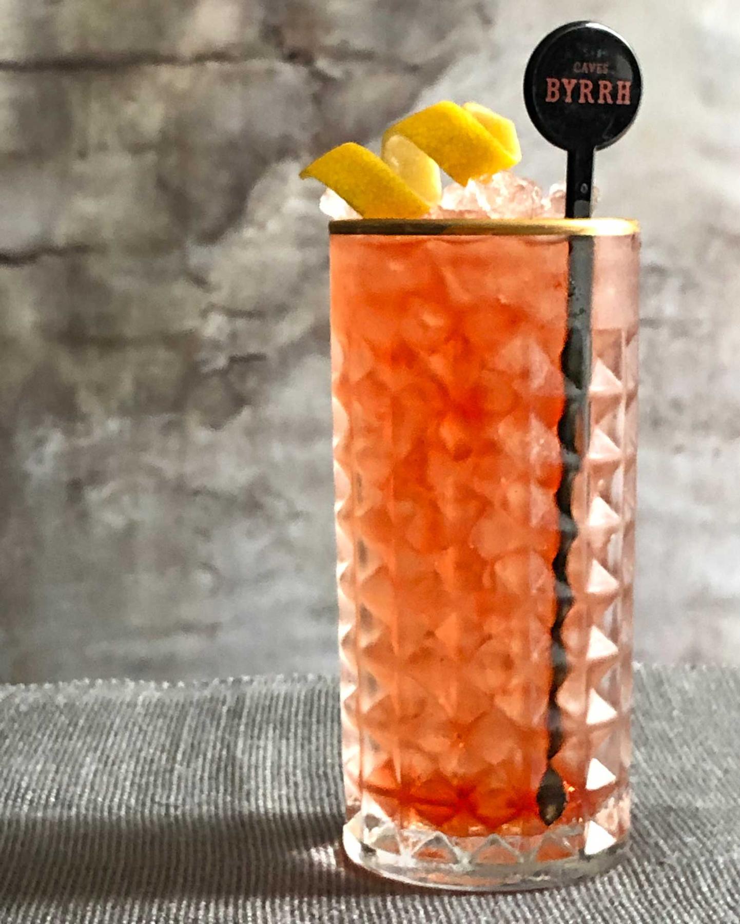 An example of the Passa Paloma, the mixed drink (drink), by Figidini, Providence, RI, featuring grapefruit soda, blanco tequila, Byrrh Grand Quinquina, and lemon twist; photo by Lee Edwards