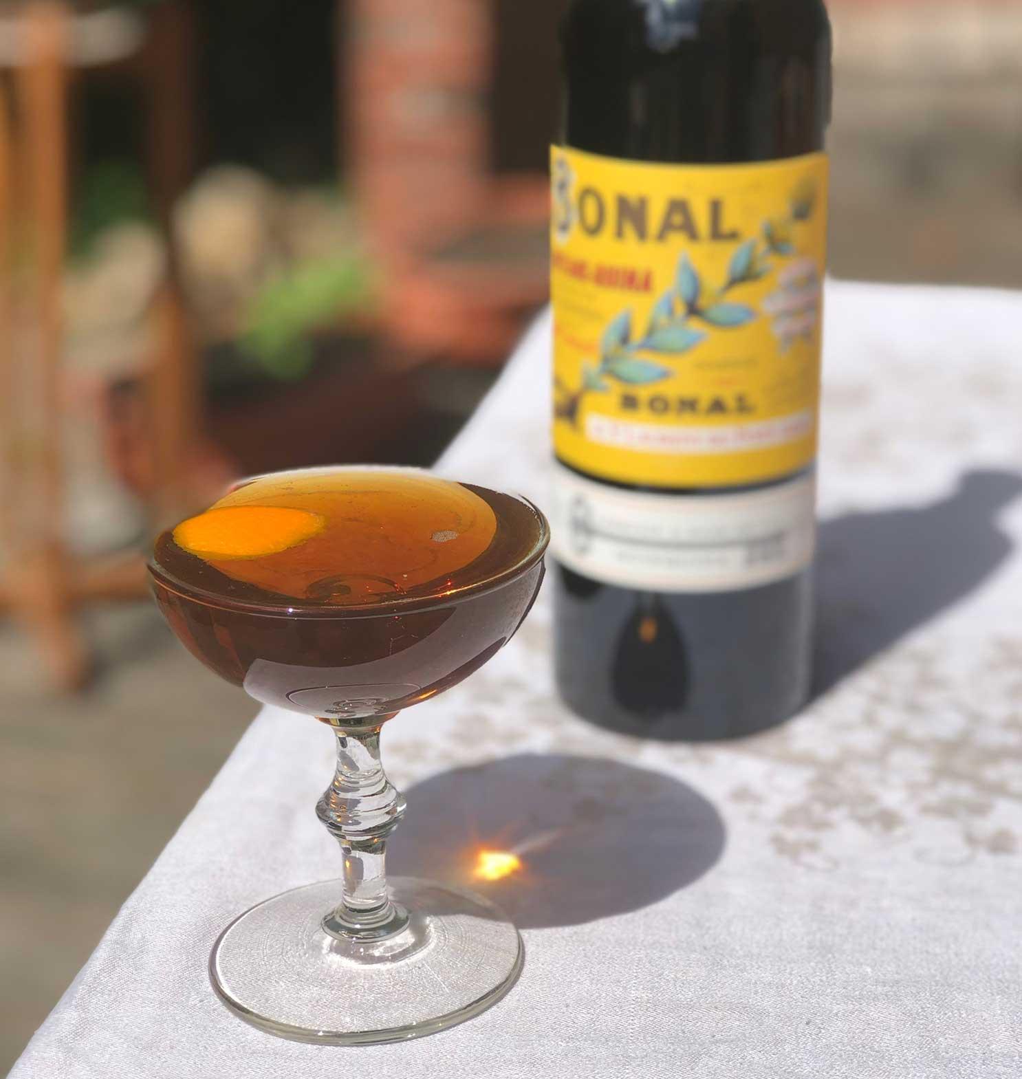 An example of the Bonal & Rye, the mixed drink (drink), by Todd Smith, San Francisco, featuring rye whiskey, Bonal Gentiane-Quina, orange bitters, Angostura bitters, and orange twist