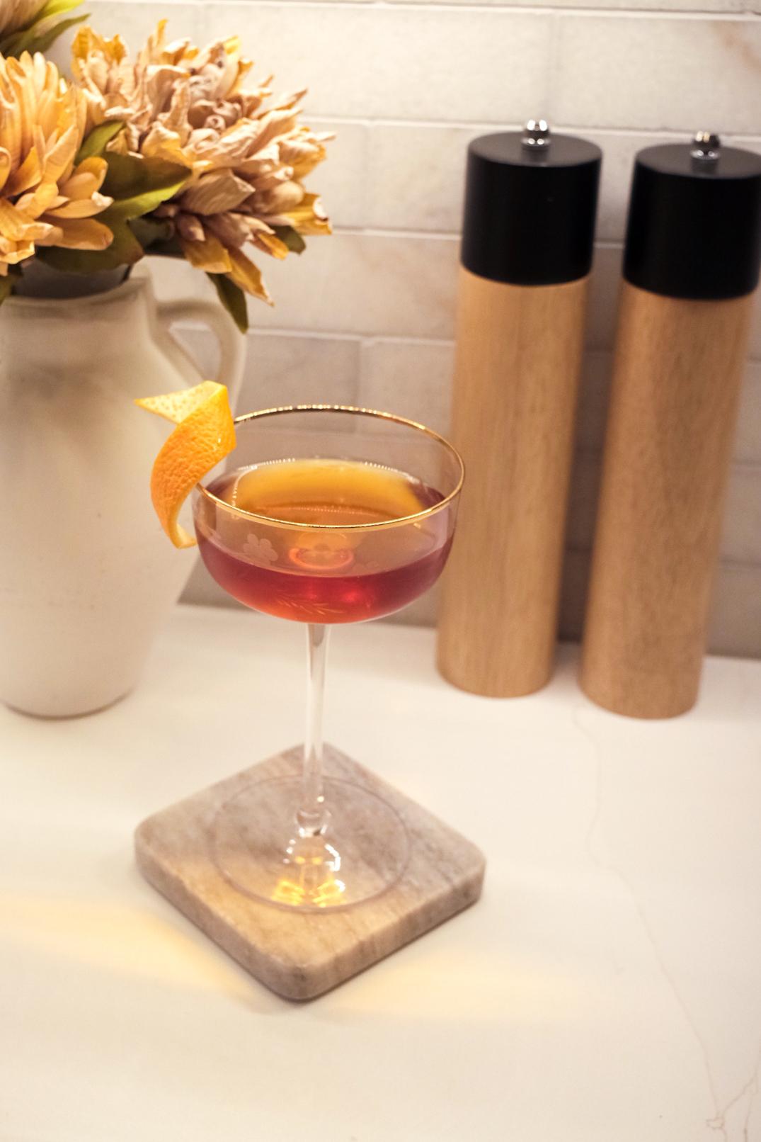 An example of the Salt & Pepper, the mixed drink (drink), Adapted from “Famous New Orleans Drinks and How to Mix ’Em”, featuring Dolin Dry Vermouth de Chambéry, Cocchi Vermouth di Torino ‘Storico’, Angostura bitters, orange bitters, and orange twist