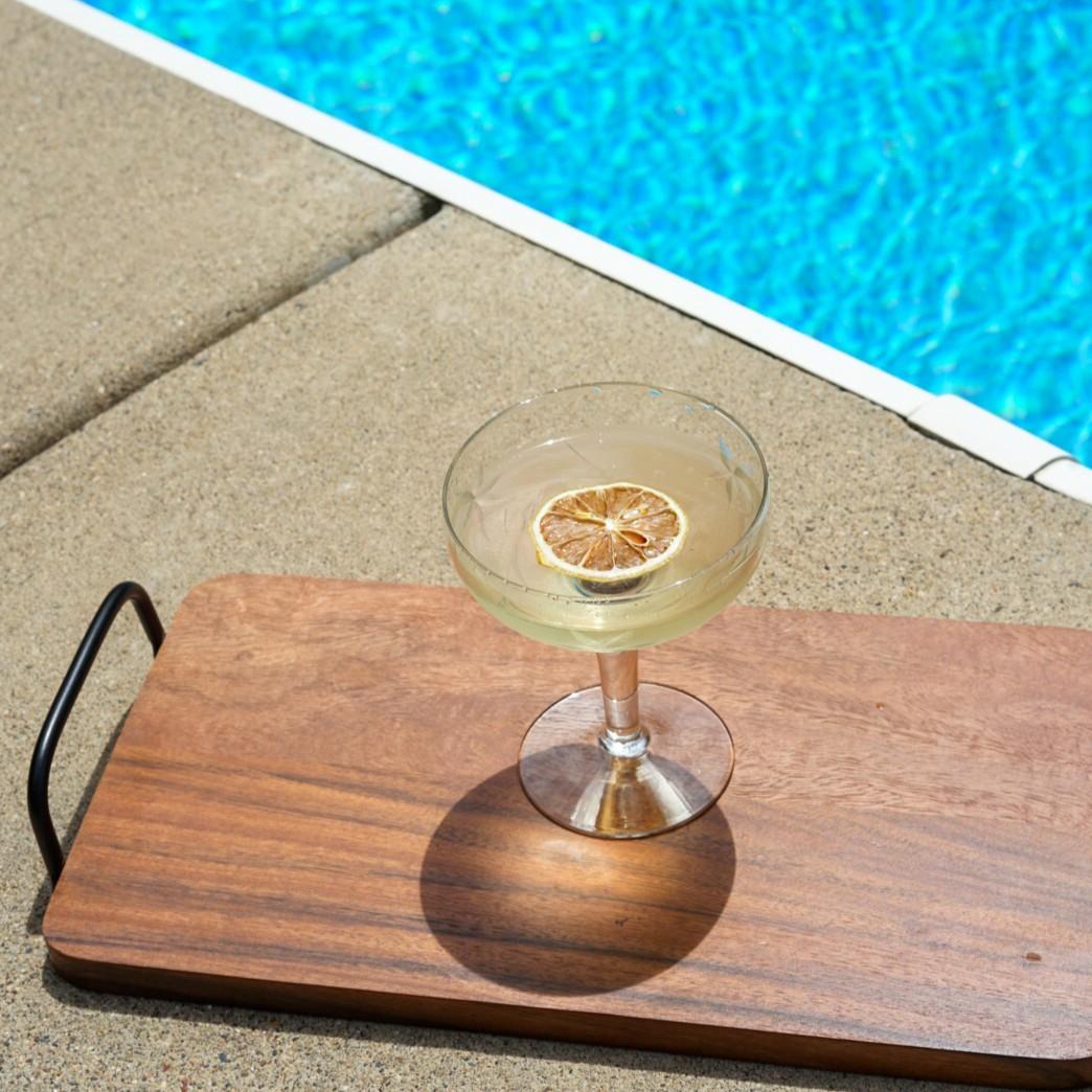An example of the La Perla, the mixed drink (drink), by Jacques Bezuidenhout, San Francisco, featuring reposado tequila, manzanilla, Rothman & Winter Orchard Pear Liqueur, and lemon twist