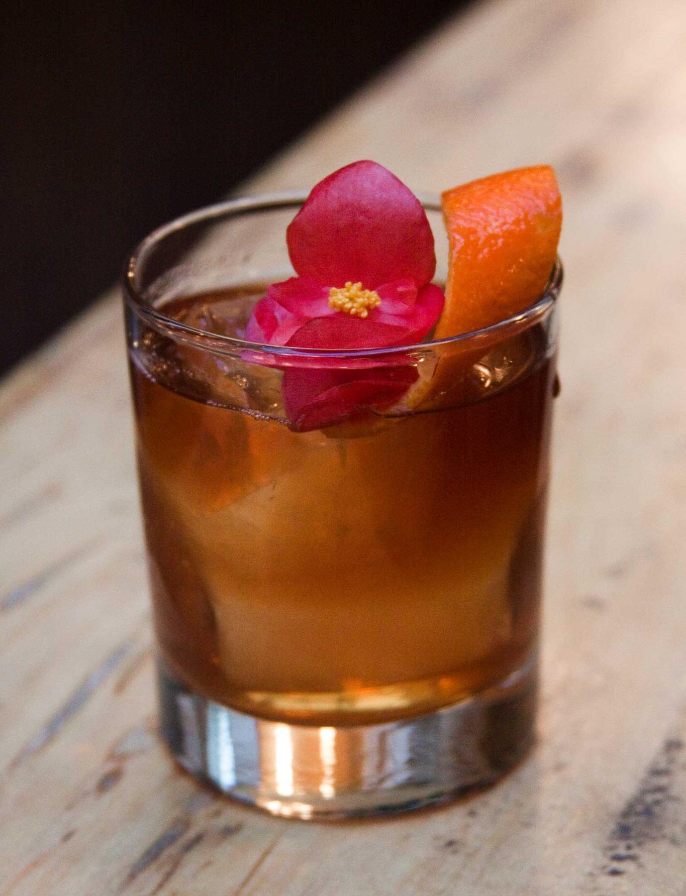 An example of the Redden Plain, the mixed drink (drink), by Ty Williams, Sisters, Brooklyn, featuring Mattei Cap Corse Rouge Quinquina, Svöl Swedish-style Aquavit, Salers Gentian Apéritif, and orange twist; photo by Austin Phelps