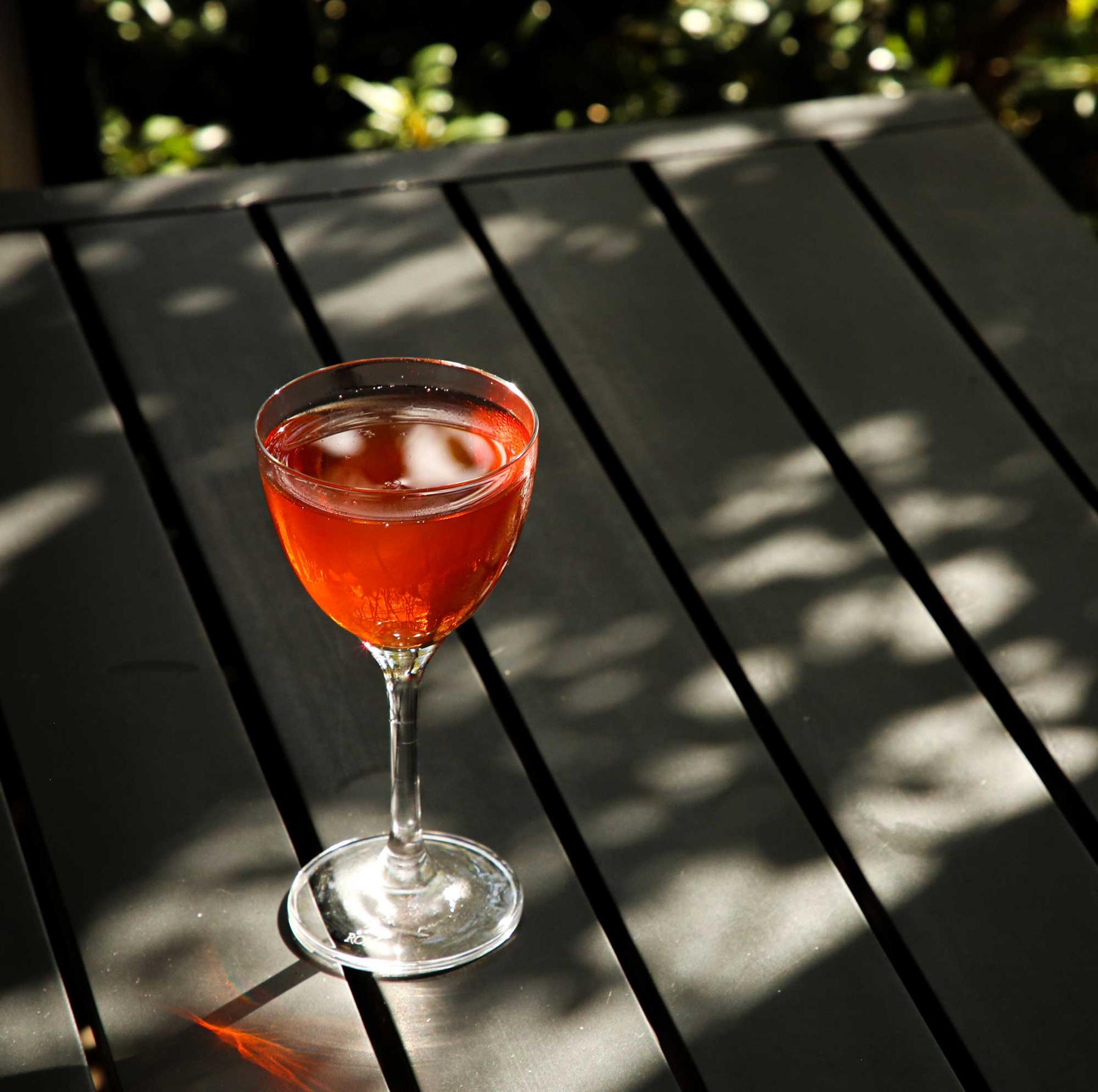 An example of the Caldera, the mixed drink (drink), by Liz Kelley, Cure, New Orleans, featuring reposado tequila, Aperitivo Cappelletti, Zirbenz Stone Pine Liqueur of the Alps, and grapefruit twist; photo by Liz Kelley