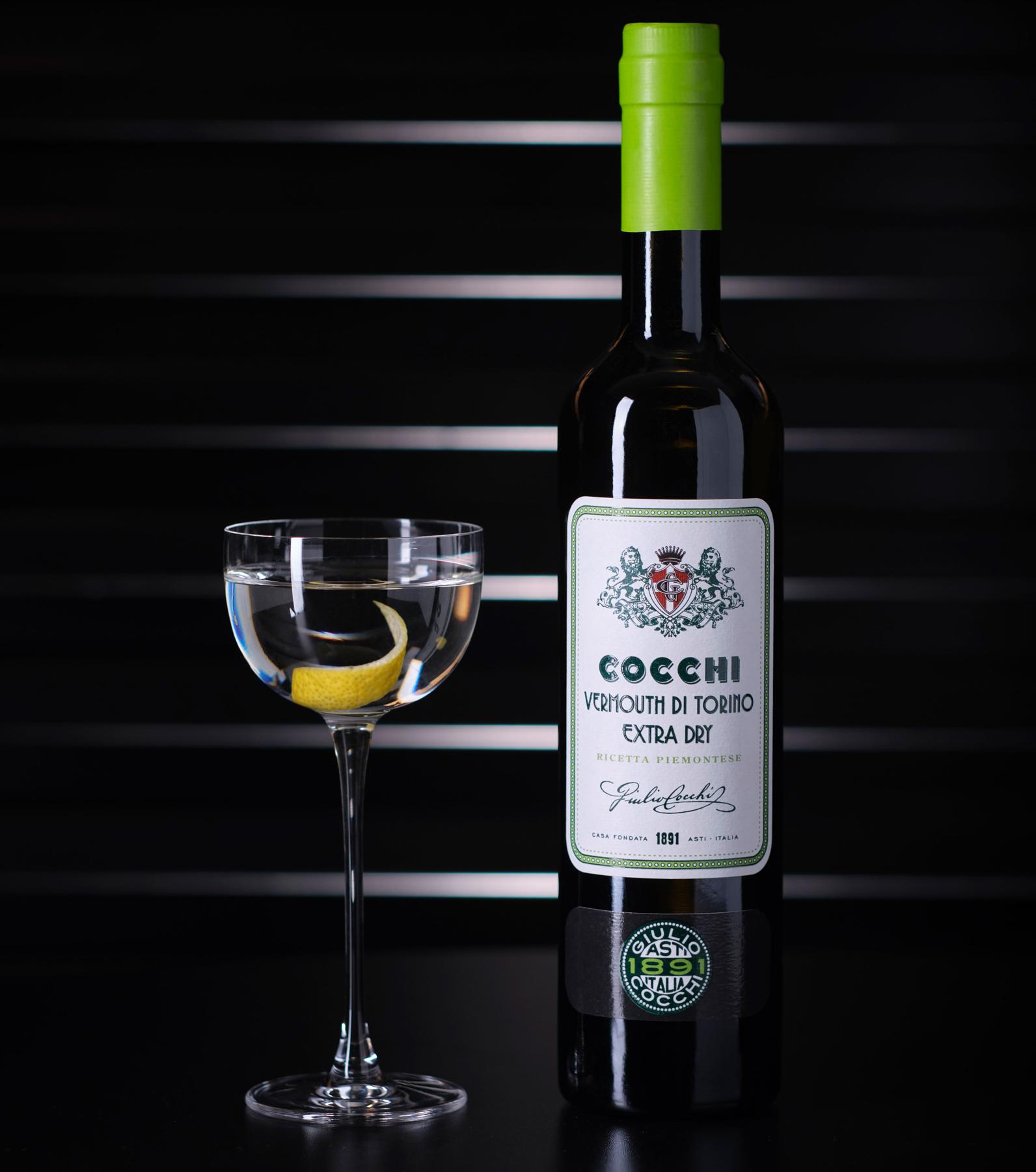 An example of the 50/50 Royal Martini, the mixed drink (drink) featuring Hayman’s Royal Dock Navy Strength Gin, Cocchi Vermouth di Torino Extra Dry, and lemon twist; photo by Cocchi