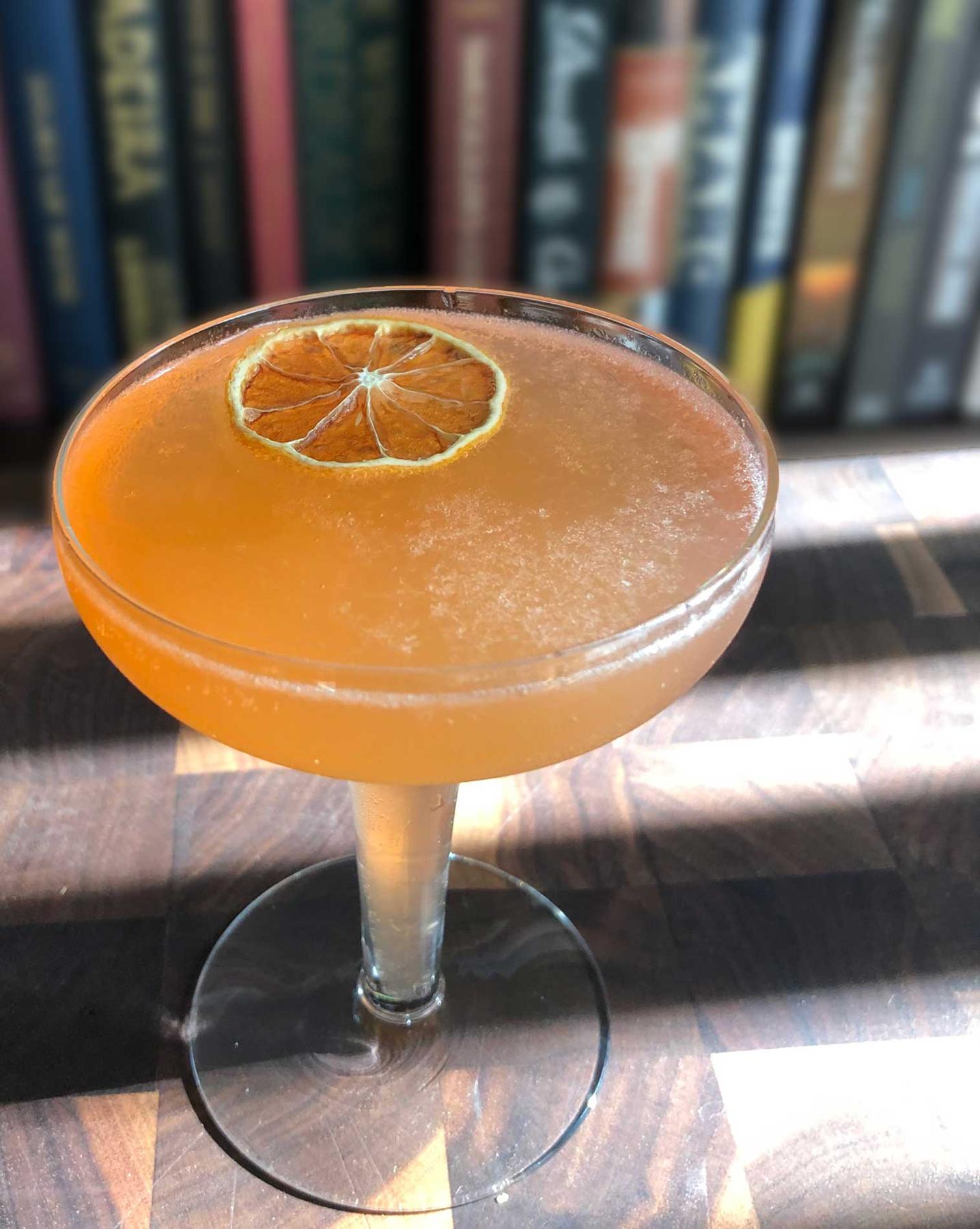 An example of the Front Porch Fizz, the mixed drink (drink), adapted from a drink by Kellie Thorn, Empire State South, Atlanta, Georgia, featuring sparkling wine, Hayman’s London Dry Gin, Aperitivo Cappelletti, watermelon syrup, and lemon juice; photo by Lee Edwards