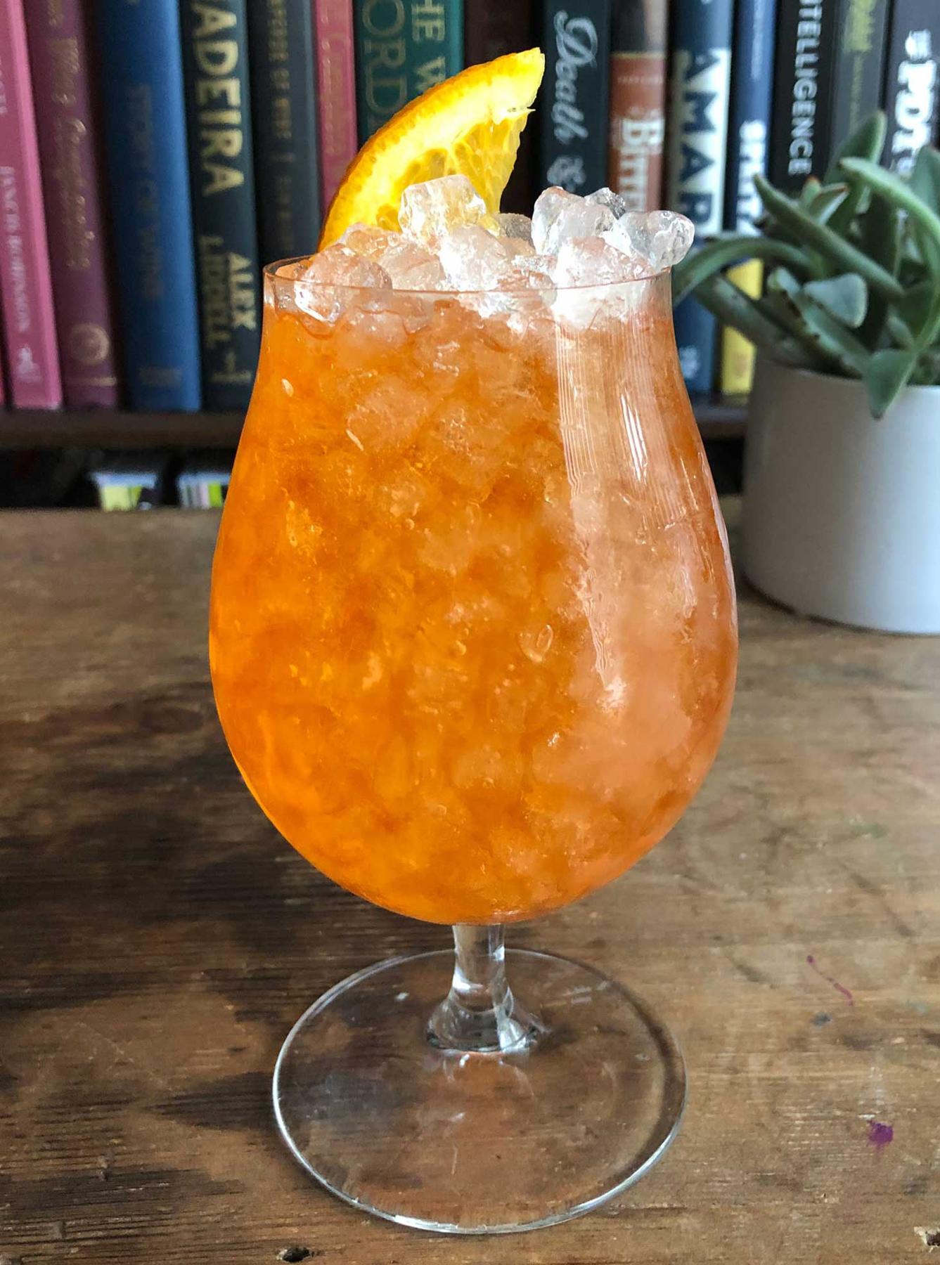 An example of the Spritz Originale, the mixed drink (drink) featuring sparkling wine, Aperitivo Cappelletti, and orange wheel; photo by Lee Edwards