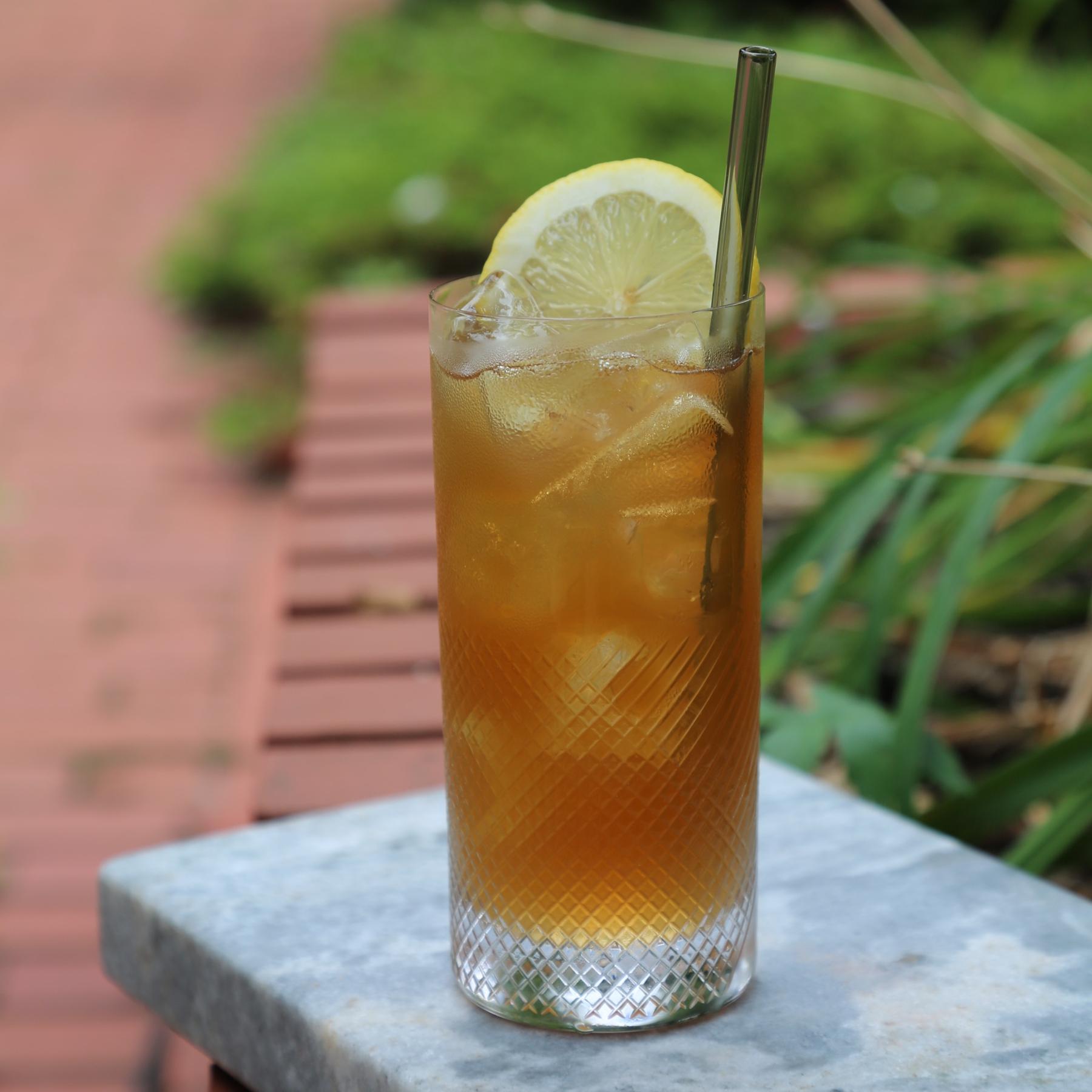 An example of the Arnold The Bavarian, the mixed drink (drink) featuring lemonade, Alpeggio Hay Liqueur, tea, and lemon wedge; photo by Megan Heinowski