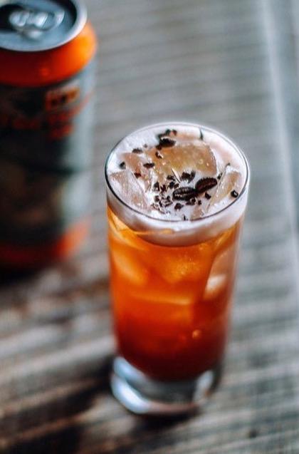 An example of the Beermüth, the mixed drink (drink), by Gavin Pierce, Room 11, Washington D.C., featuring india pale ale, Byrrh Grand Quinquina, coffee syrup, lemon juice, india pale ale, and cacao nib