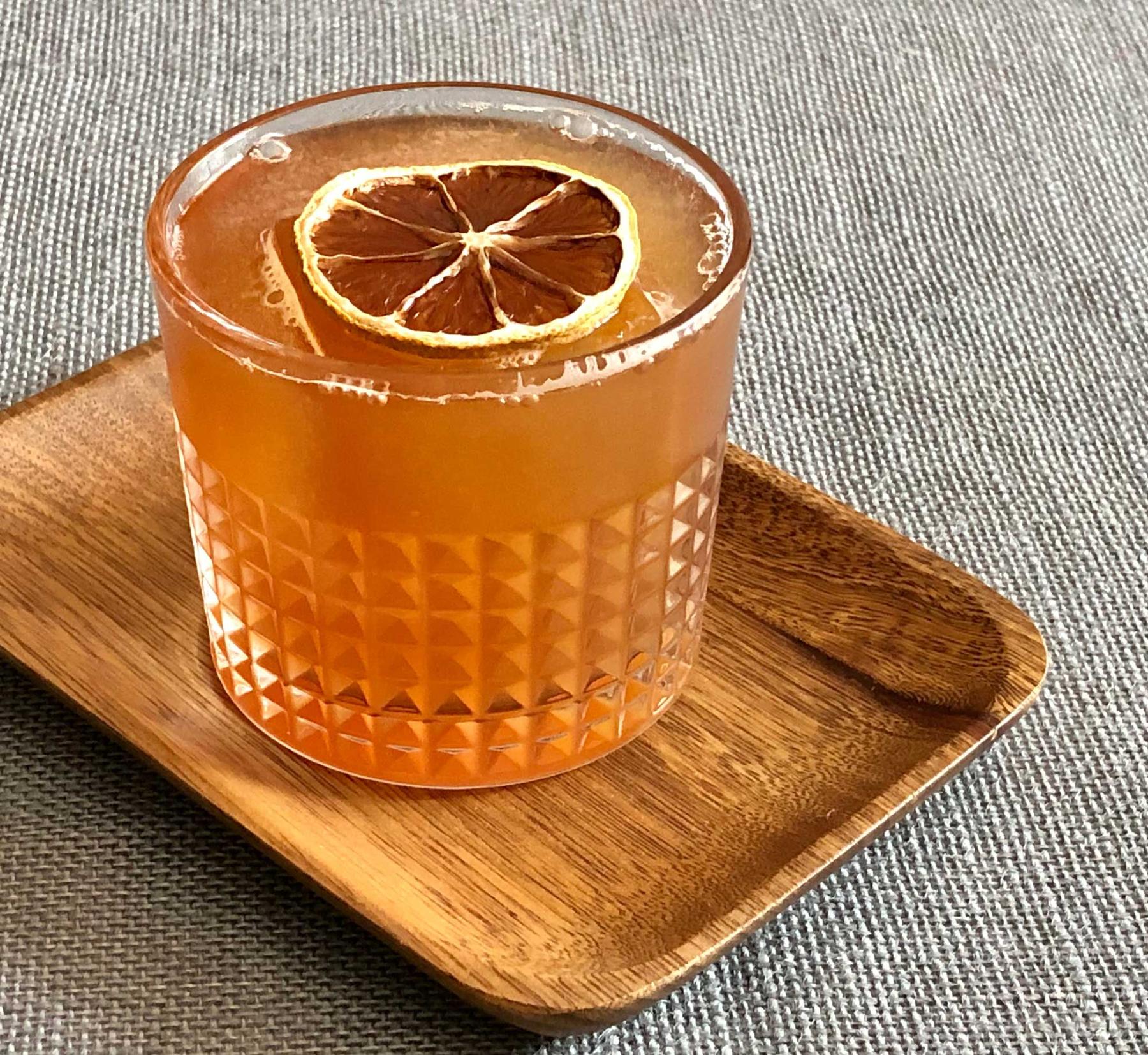 An example of the Blackheart, the mixed drink (drink), by Brick & Mortar, Cambridge, MA, featuring amber ale, Batavia Arrack van Oosten, St. Elizabeth Allspice Dram, brown sugar syrup, orange juice, lime juice, and Angostura bitters; photo by Lee Edwards