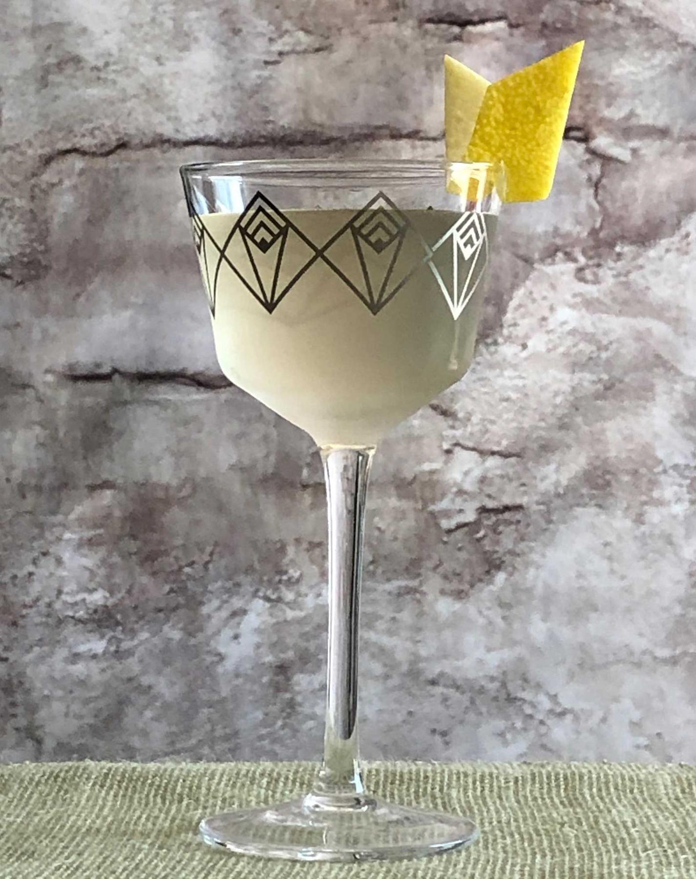 An example of the Flowering Pear, the mixed drink (drink) featuring Dolin Dry Vermouth de Chambéry, Rothman & Winter Orchard Pear Liqueur, absinthe, and lemon twist; photo by Lee Edwards
