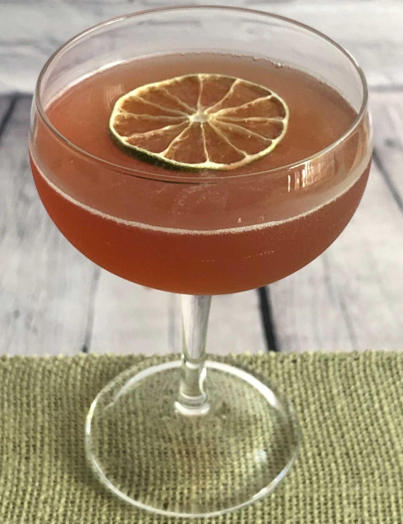 An example of the Charlie Chaplin, the mixed drink (drink), by Embury, The Fine Art of Mixing Drinks, featuring Blume Marillen Apricot Eau-de-Vie, Hayman’s Sloe Gin, and lime juice; photo by Lee Edwards