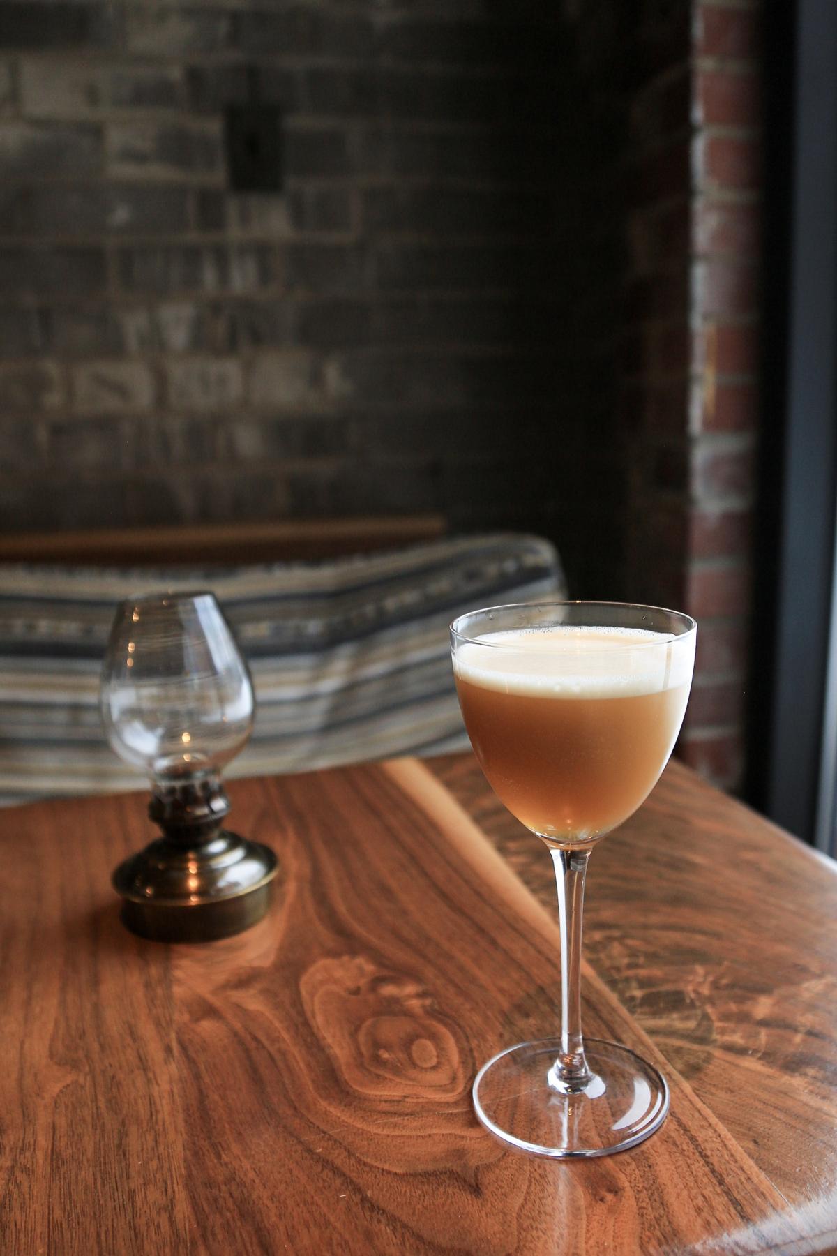 An example of the French Hay Ride, the mixed drink (drink) featuring calvados, Alpeggio Hay Liqueur, lemon juice, and Nux Alpina Walnut Liqueur; photo by Megan Heinowski