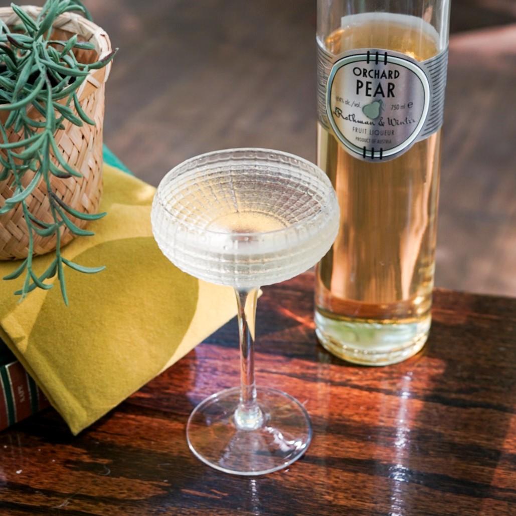 An example of the Paring Down, the mixed drink (drink) featuring Rothman & Winter Orchard Pear Liqueur, Cocchi Vermouth di Torino Extra Dry, and Bittercube Orange Bitters; photo by Madison Young