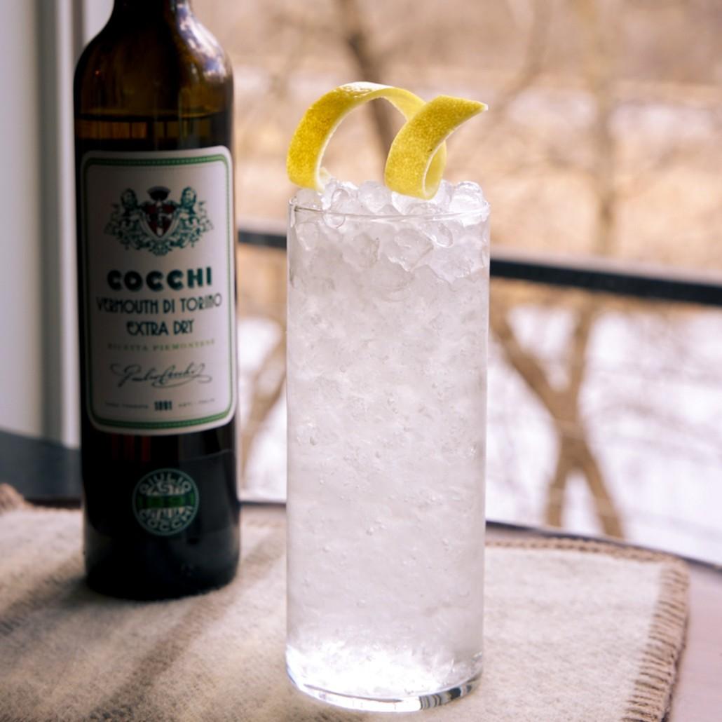 An example of the Acqua di Fiore, the mixed drink (drink) featuring Cocchi Vermouth di Torino Extra Dry, tonic, and lemon twist