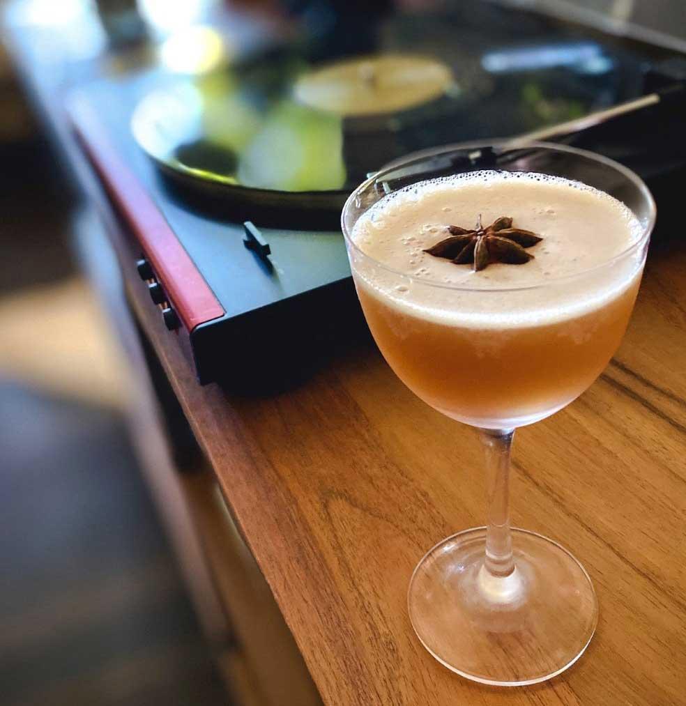 An example of the Lion’s Tail, the mixed drink (drink) featuring bourbon whiskey, St. Elizabeth Allspice Dram, lime juice, simple syrup, Angostura bitters, and lime wheel; photo by @losangeles.cocktails