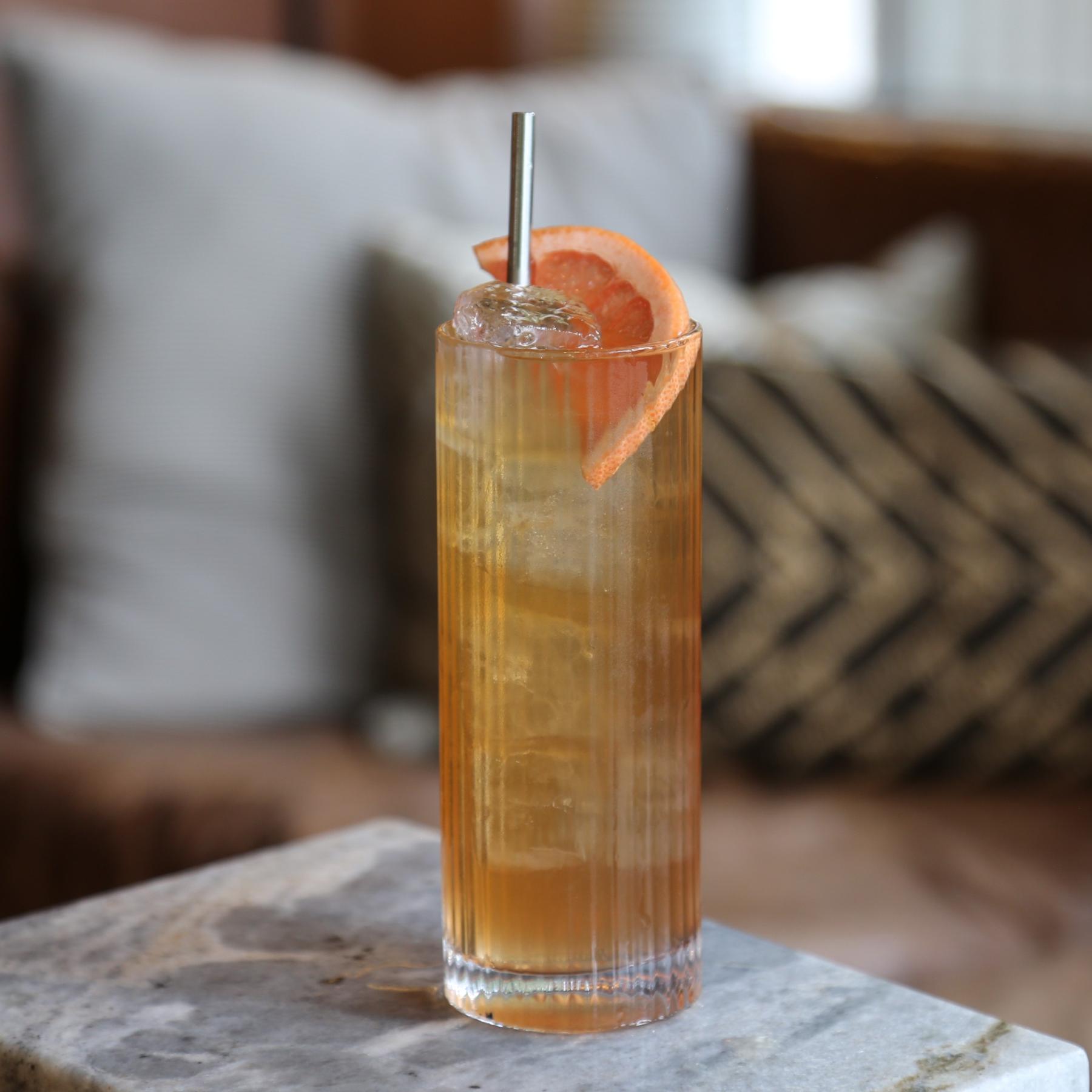 An example of the Astral Plank, the mixed drink (drink), Adapted from Tyson Buhler, featuring soda water, Henriques & Henriques Seco Especial 5 Year Old Madeira, Salers Gentian Apéritif, lemon juice, simple syrup, Peychaud’s Aromatic Cocktail Bitters, and grapefruit wedge; photo by Megan Heinowski