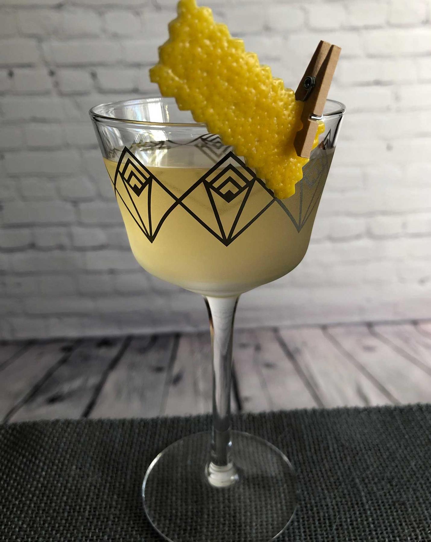 An example of the Mediterranean Martini, the mixed drink (drink) featuring london dry gin, Mattei Cap Corse Blanc Quinquina, orange bitters, and lemon twist; photo by Lee Edwards