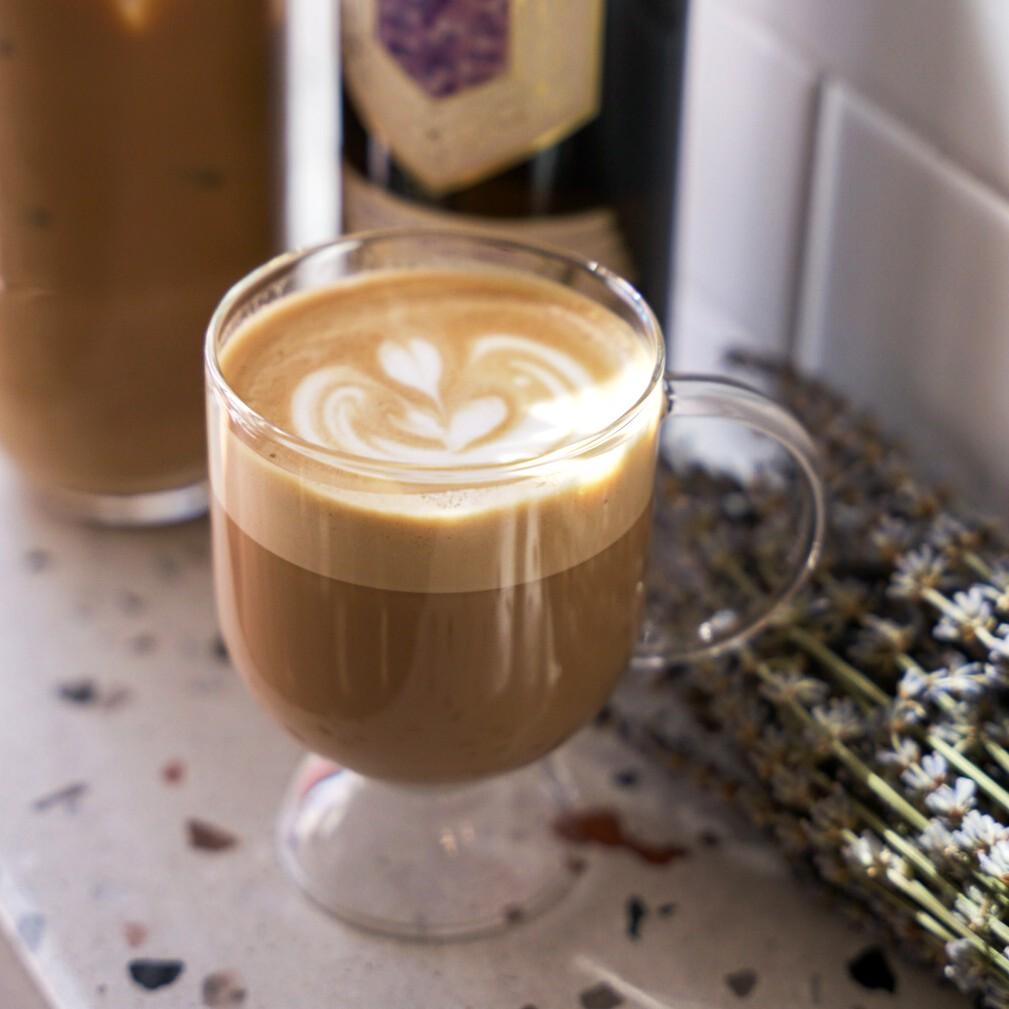 An example of the Honey Lavender Latte, the mixed drink (drink) featuring caffè latte, Sevez Honey Lavender, and lavender; photo by Madison Young