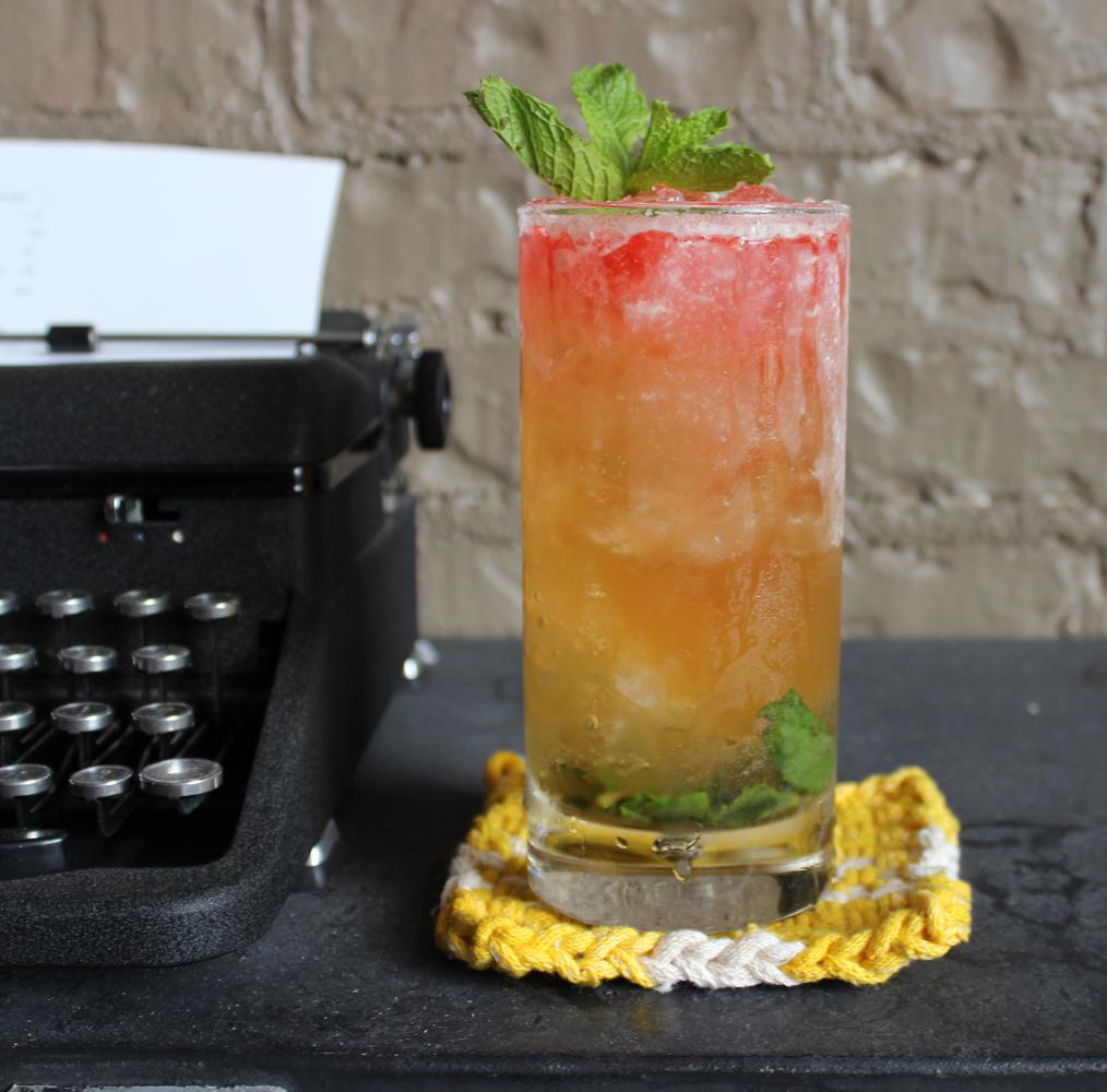An example of the Rothko no. 2, the mixed drink (drink), by Sarah Goyne, Little Rock AR, featuring VS cognac, Matifoc Rancio Sec, simple syrup, lemon juice, Peychaud’s Aromatic Cocktail Bitters, and sprig of mint; photo by Amy Kelley Bell