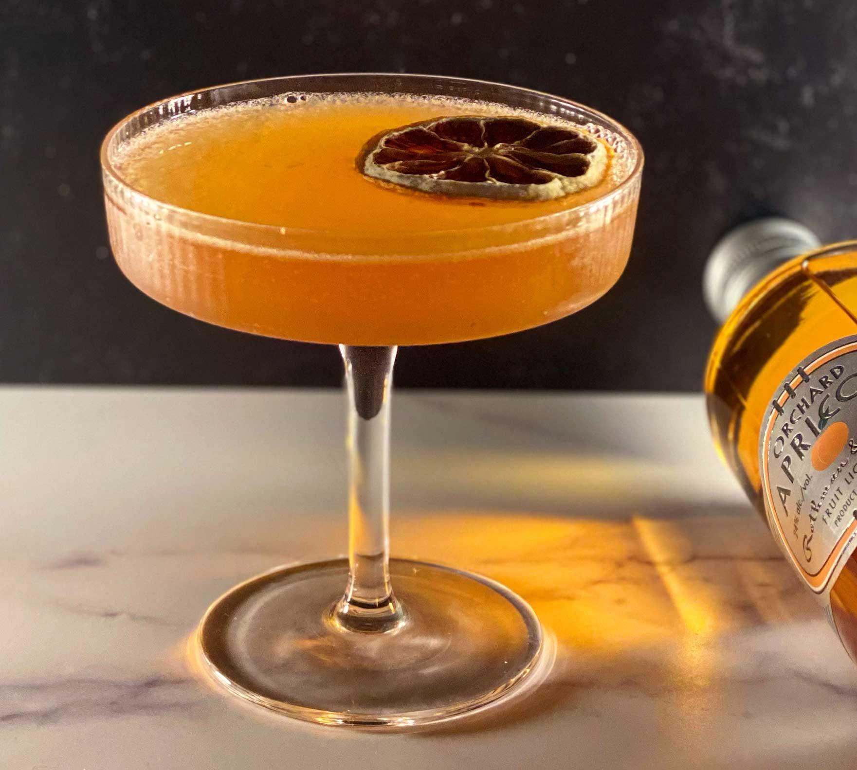 An example of the Flor de Jerez, the mixed drink (drink), by Joaquìn Simò, NYC, featuring amontillado, lemon juice, Smith & Cross Traditional Jamaica Rum, rich simple syrup, Rothman & Winter Orchard Apricot Liqueur, and Angostura bitters; photo by @slightlygarnished