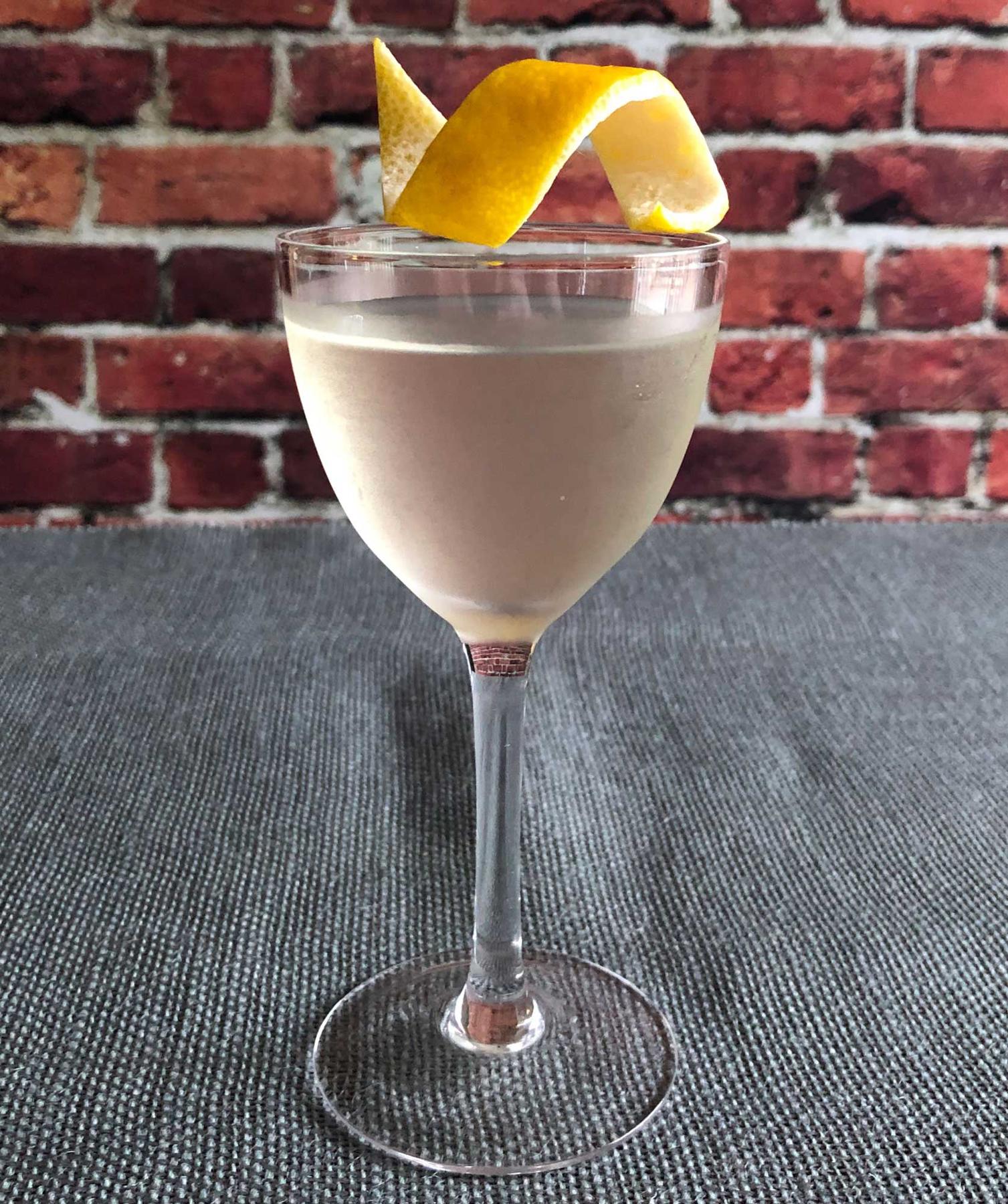 An example of the 600,000 Pesos, the mixed drink (drink) featuring mezcal, Dolin Blanc Vermouth de Chambéry, Dolin Génépy le Chamois Liqueur, and lemon twist; photo by Lee Edwards