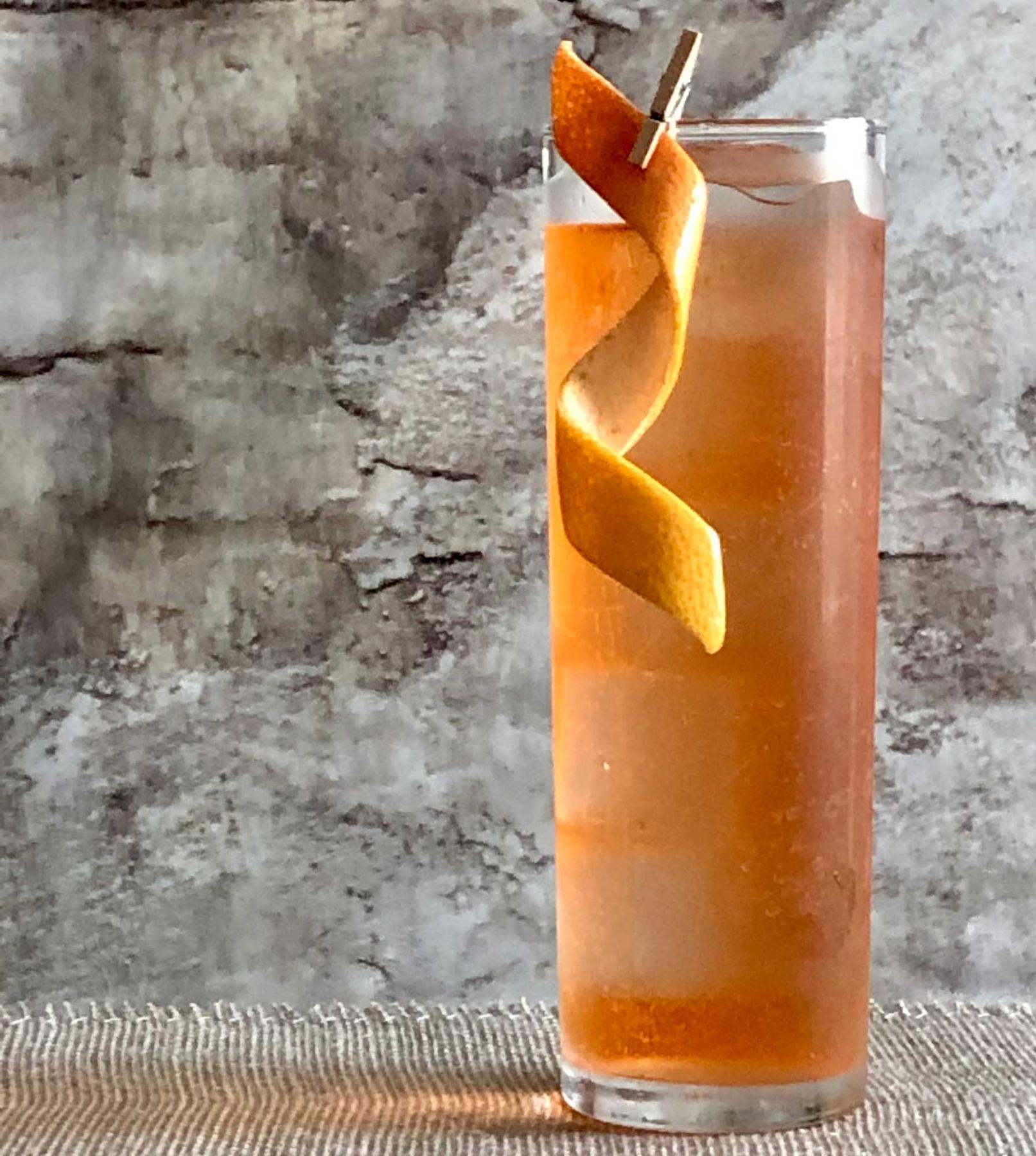 An example of the Mesa Spritz, the mixed drink (drink) featuring soda water, Dolin Dry Vermouth de Chambéry, Aperitivo Cappelletti, and grapefruit twist; photo by Lee Edwards