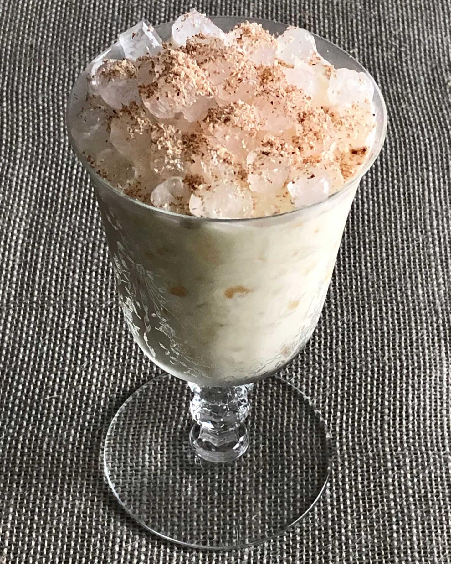 An example of the Caribbean Milk Punch, the mixed drink (drink), by Brennan’s Restaurant, New Orleans, Louisiana, featuring Smith & Cross Traditional Jamaica Rum, vanilla syrup, cream, bourbon whiskey, and grated nutmeg; photo by Lee Edwards