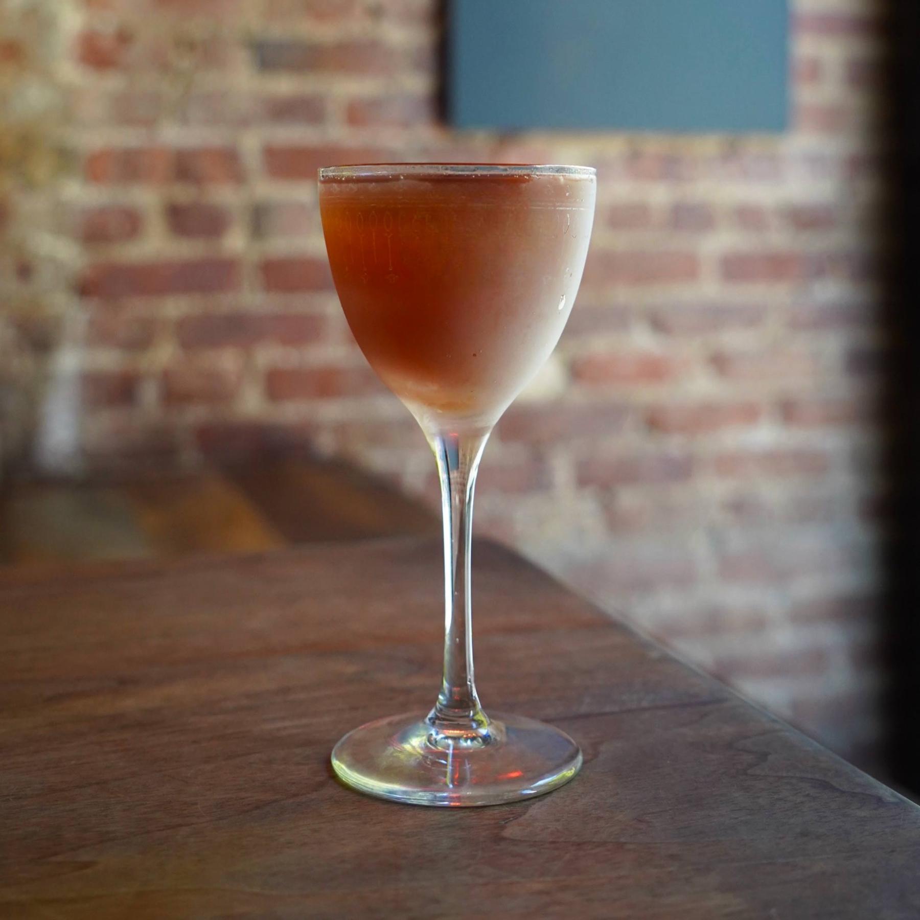 An example of the R&D, the mixed drink (drink), by Dave Arnold, Bar Contra, featuring Rittenhouse 100-proof Bonded Rye, Averell Damson Plum Gin Liqueur, and saline solution; photo by Bar Contra