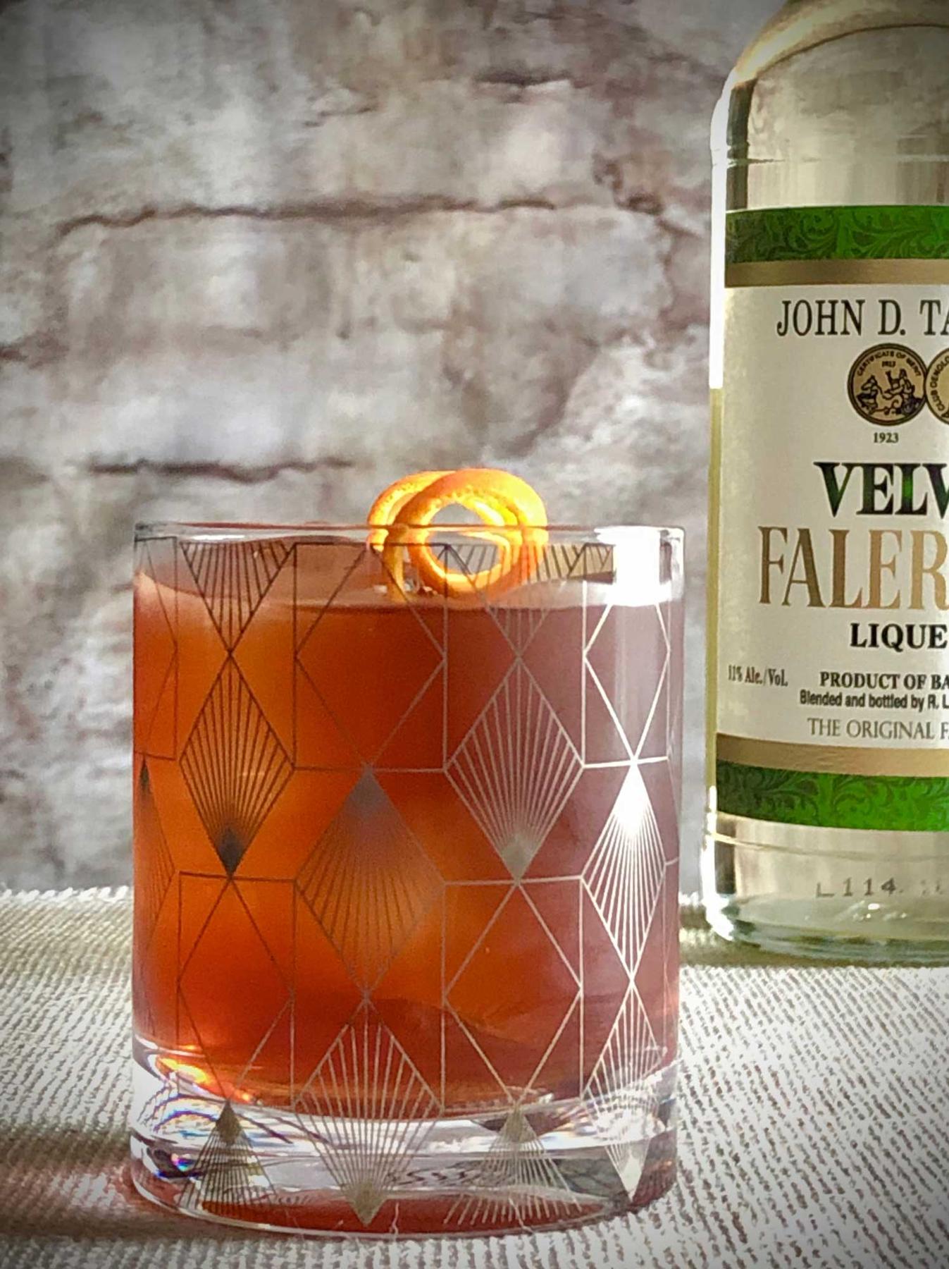 An example of the Maïs et Huile, the mixed drink (drink) featuring Matifoc Rancio Sec, John D. Taylor’s Velvet Falernum, Angostura bitters, and orange twist; photo by Lee Edwards