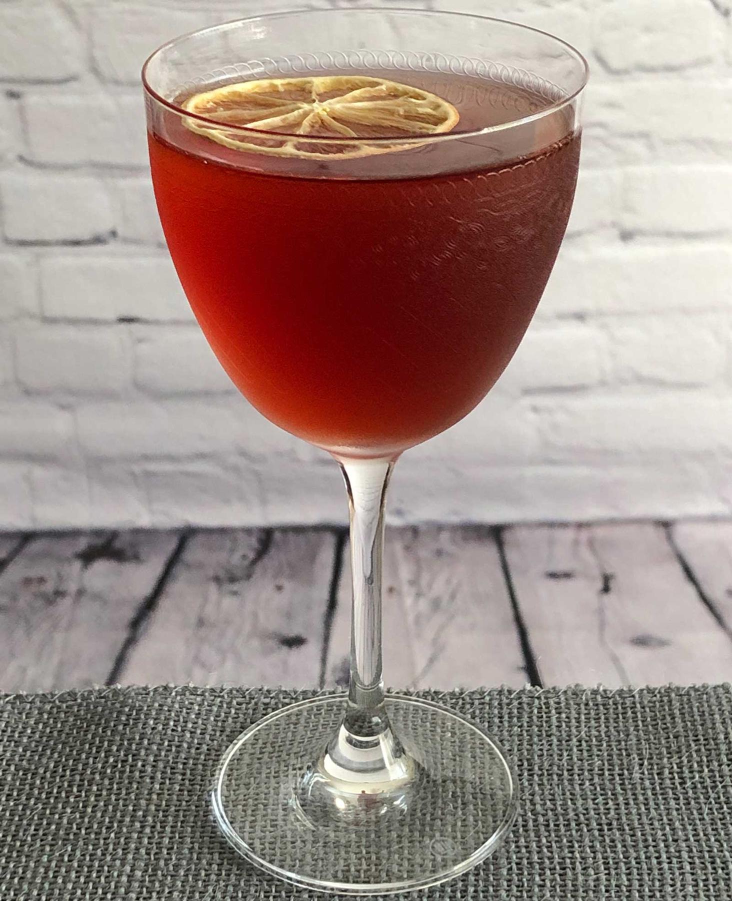 An example of the The Prime Directive no. 2, the mixed drink (drink) featuring Dolin Dry Vermouth de Chambéry, Salers Gentian Apéritif, Byrrh Grand Quinquina, and lemon twist; photo by Lee Edwards