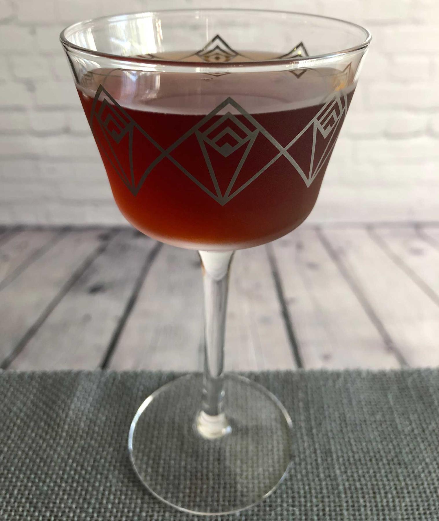 An example of the Navy Cut Shim, the mixed drink (drink), by Bob Herczeg, Sur-Lie, Maine, featuring Tresmontaine “tabacal” Rancio, Cocchi Dopo Teatro Vermouth Amaro, Aperitivo Cappelletti, Smith & Cross Traditional Jamaica Rum, orange bitters, and Laphroaig 10 Year Single Malt Scotch; photo by Lee Edwards