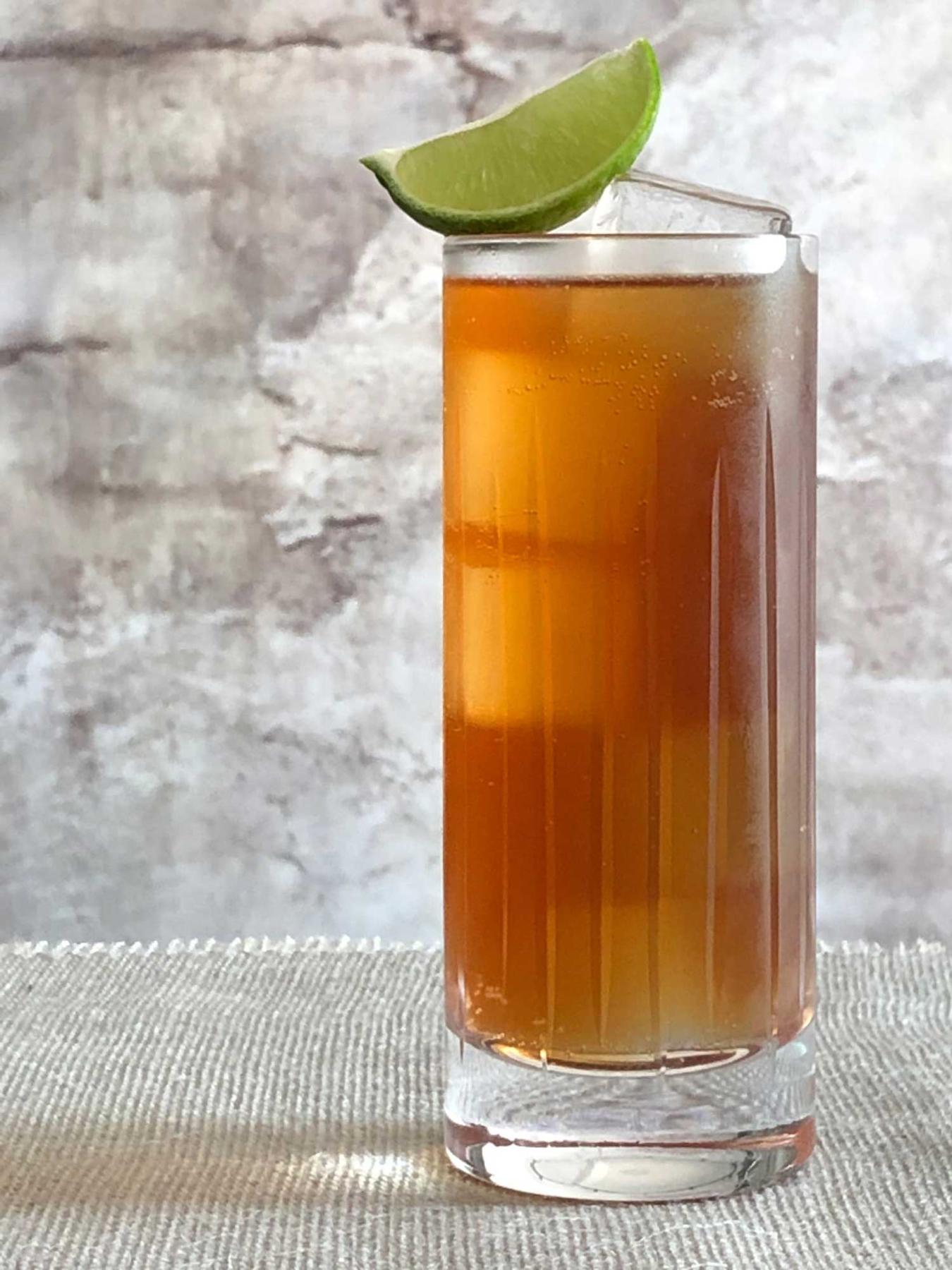 An example of the Holy Roman Highball, the mixed drink (drink) featuring ginger beer, Cocchi Vermouth di Torino ‘Storico’, mezcal, lime juice, and lime wedge; photo by Lee Edwards
