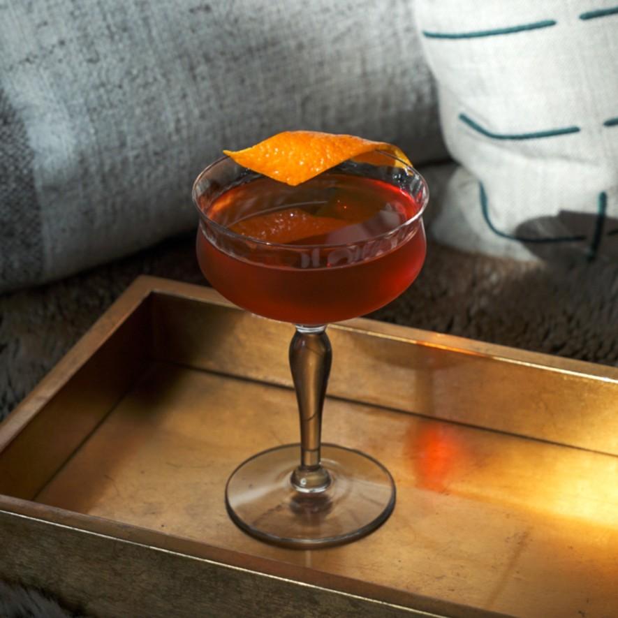 An example of the Coco in New York, the mixed drink (drink) featuring bourbon whiskey, Meunier Cacao Noir Liqueur, Cocchi Vermouth di Torino ‘Storico’, and orange bitters; photo by Madison Young