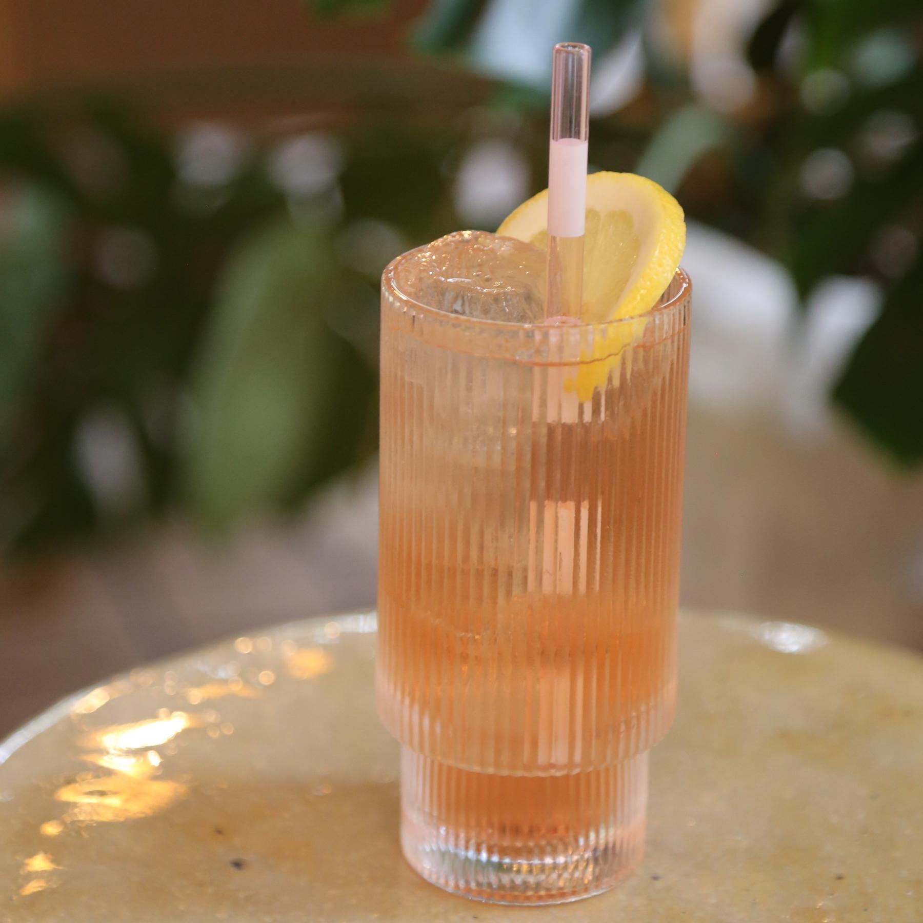An example of the Chamby Seltzer, the mixed drink (drink) featuring seltzer, Chamberyzette, and lemon wheel; photo by Megan Heinowski