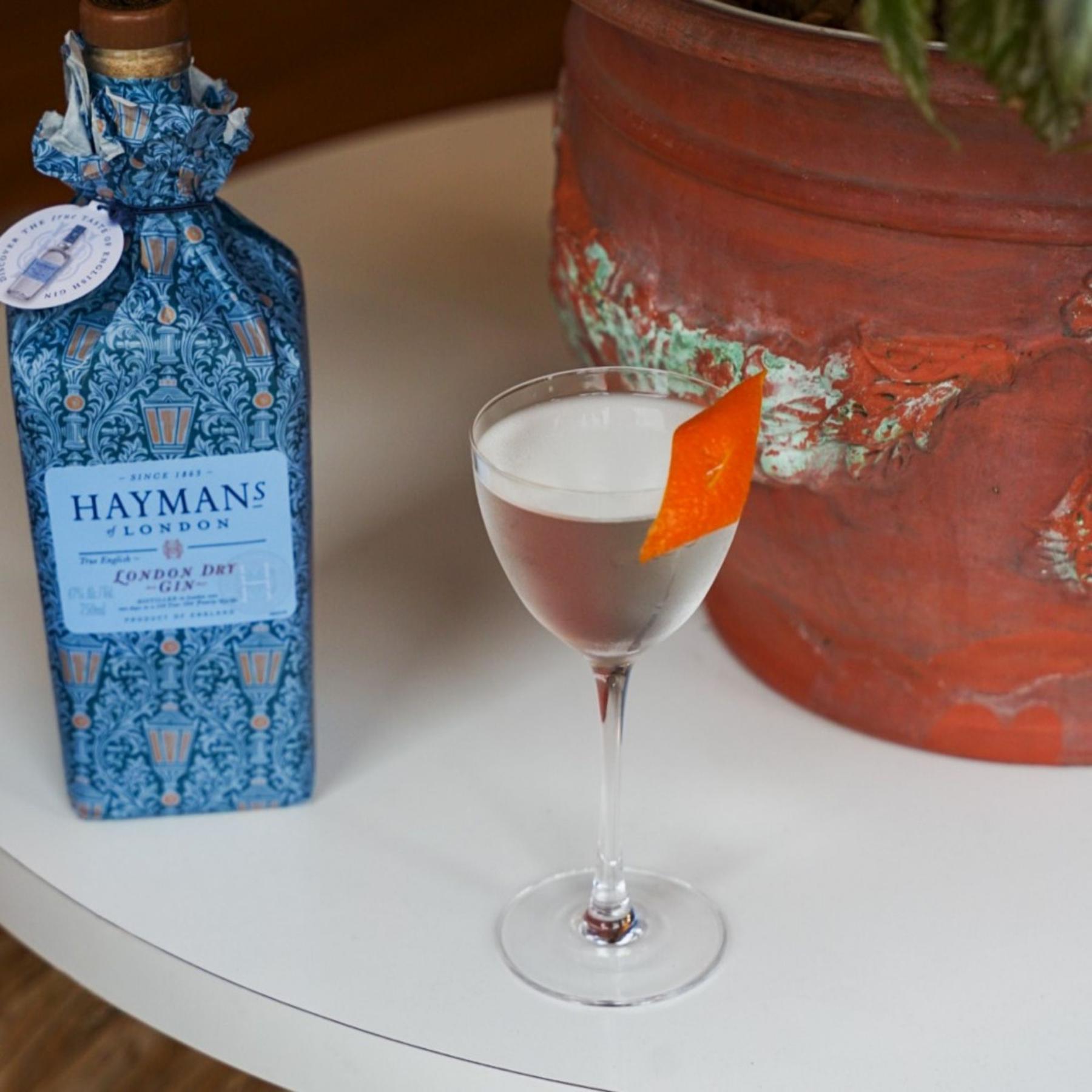 An example of the La Contadi, the mixed drink (drink), by Tyler Jay Wang, Boston, featuring Hayman’s London Dry Gin, Etter Kirsch, Comoz Blanc Vermouth de Chambèry, and orange twist; photo by Madison Young