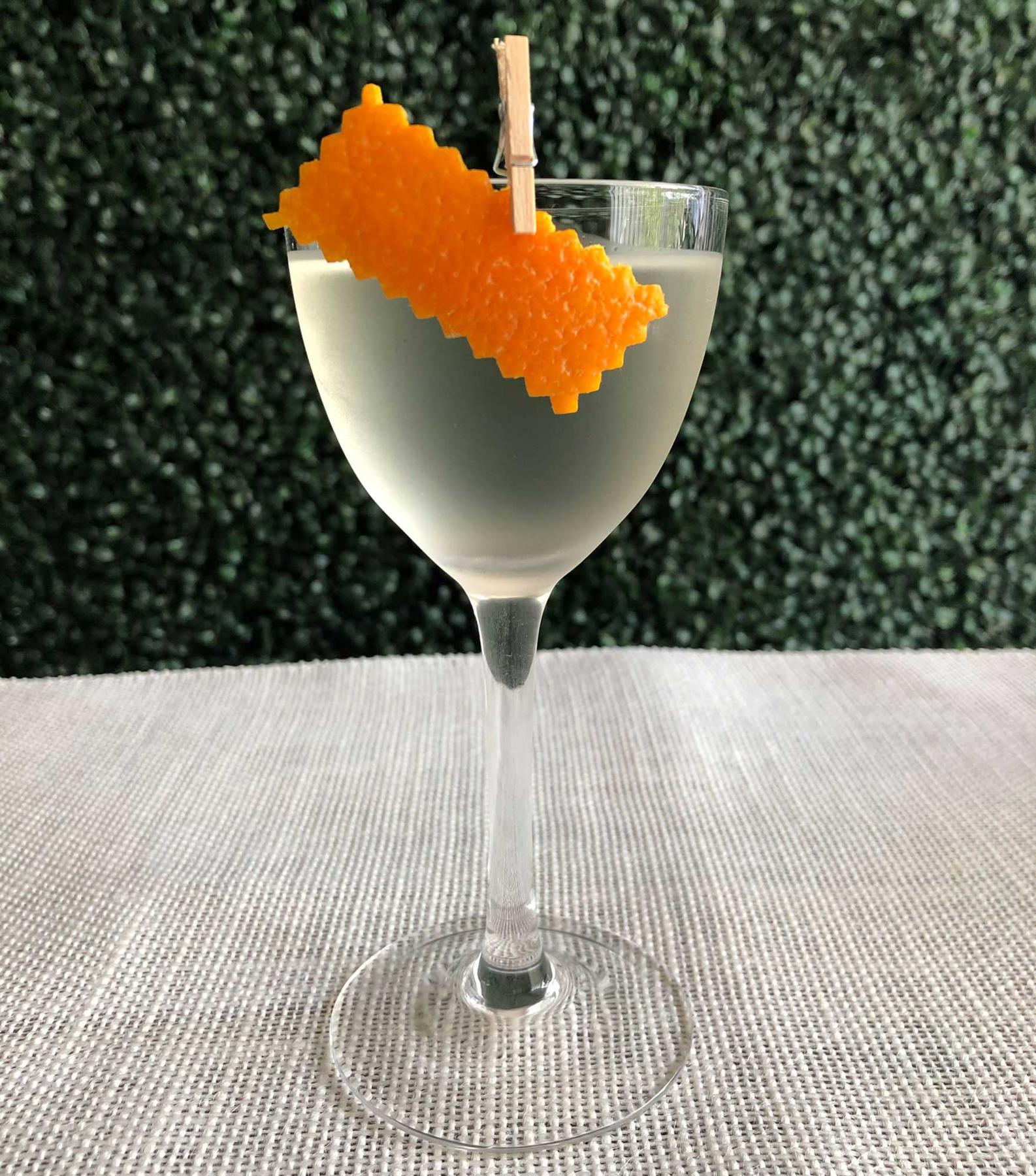 An example of the La Contadi, the mixed drink (drink), by Tyler Jay Wang, Kirkland Tap and Trotter, Boston, featuring Hayman’s London Dry Gin, Etter Kirsch, Comoz Blanc Vermouth de Chambèry, and orange twist; photo by Lee Edwards