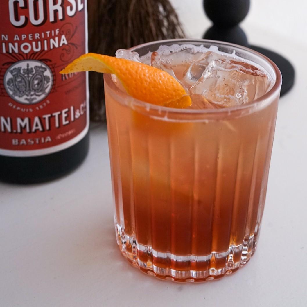 An example of the Starboard, the mixed drink (drink) featuring Mattei Cap Corse Rouge Quinquina, seltzer, and orange twist; photo by Madison Young