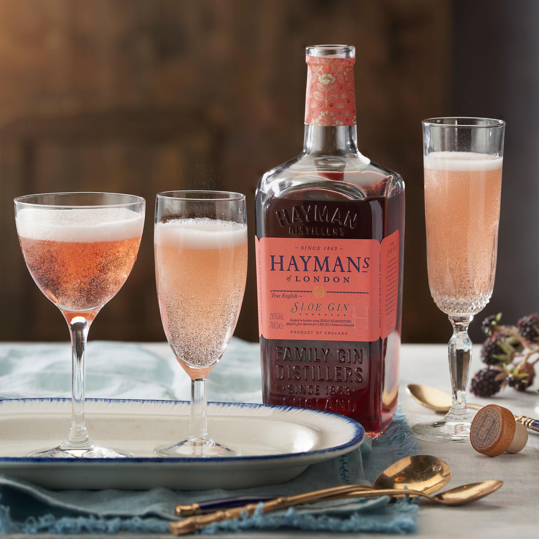 An example of the Sloe Royale, the mixed drink (drink) featuring sparkling wine, Hayman’s Sloe Gin, and lemon twist; photo by Hayman Distillers