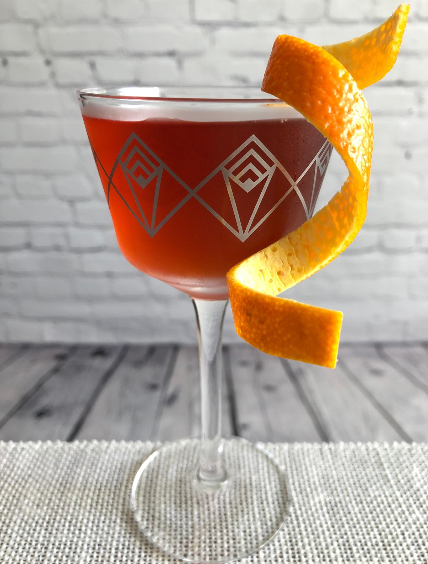 An example of the The Italian Job, the mixed drink (drink), by Joseph Akhavan, Mabel, Paris, featuring Smith & Cross Traditional Jamaica Rum, Cocchi Americano Bianco, Aperitivo Mazzura, Byrrh Grand Quinquina, and orange bitters; photo by Lee Edwards