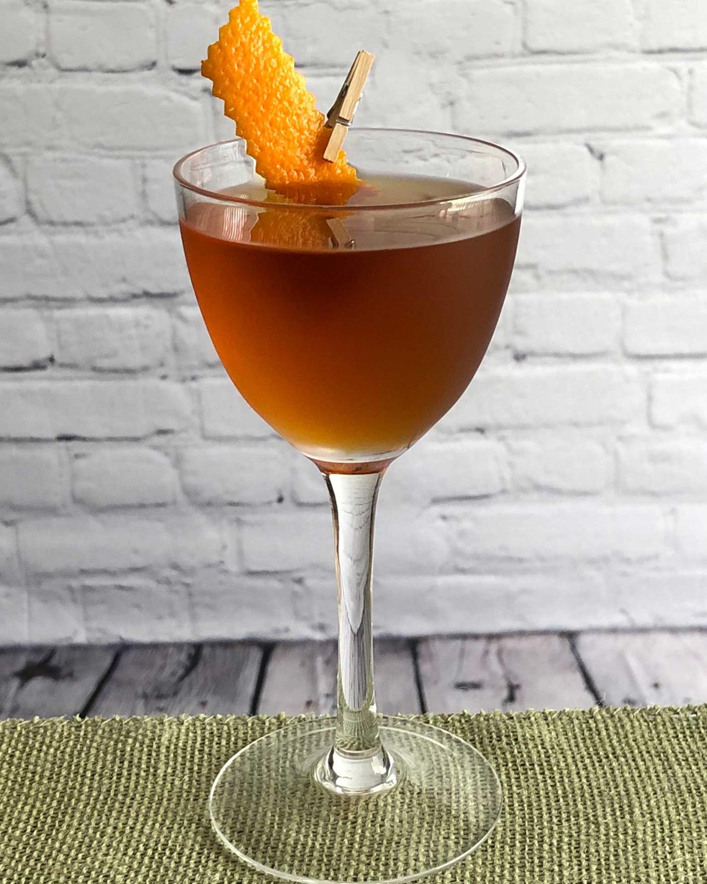 An example of the Hackensack, the mixed drink (drink), by based on the Newark, PDT, New York City, featuring apple brandy, Cocchi Vermouth di Torino ‘Storico’, maraschino liqueur, Elisir Novasalus, kosher salt, and orange twist; photo by Lee Edwards