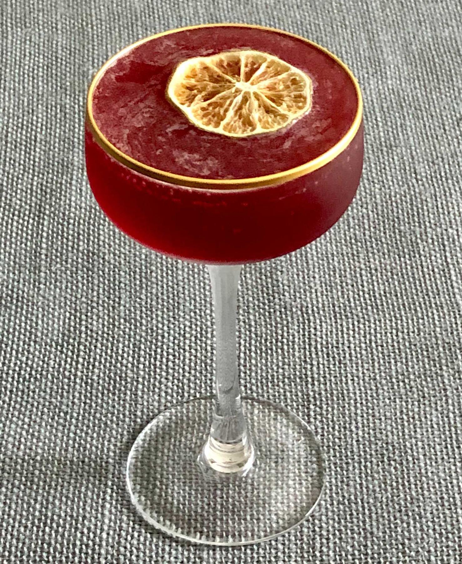 An example of the Continental Daiquiri, the mixed drink (drink) featuring light cuban-style rum, Rothman & Winter Orchard Elderberry Liqueur, lemon juice, lime juice, rich simple syrup, and lime wheel; photo by Lee Edwards