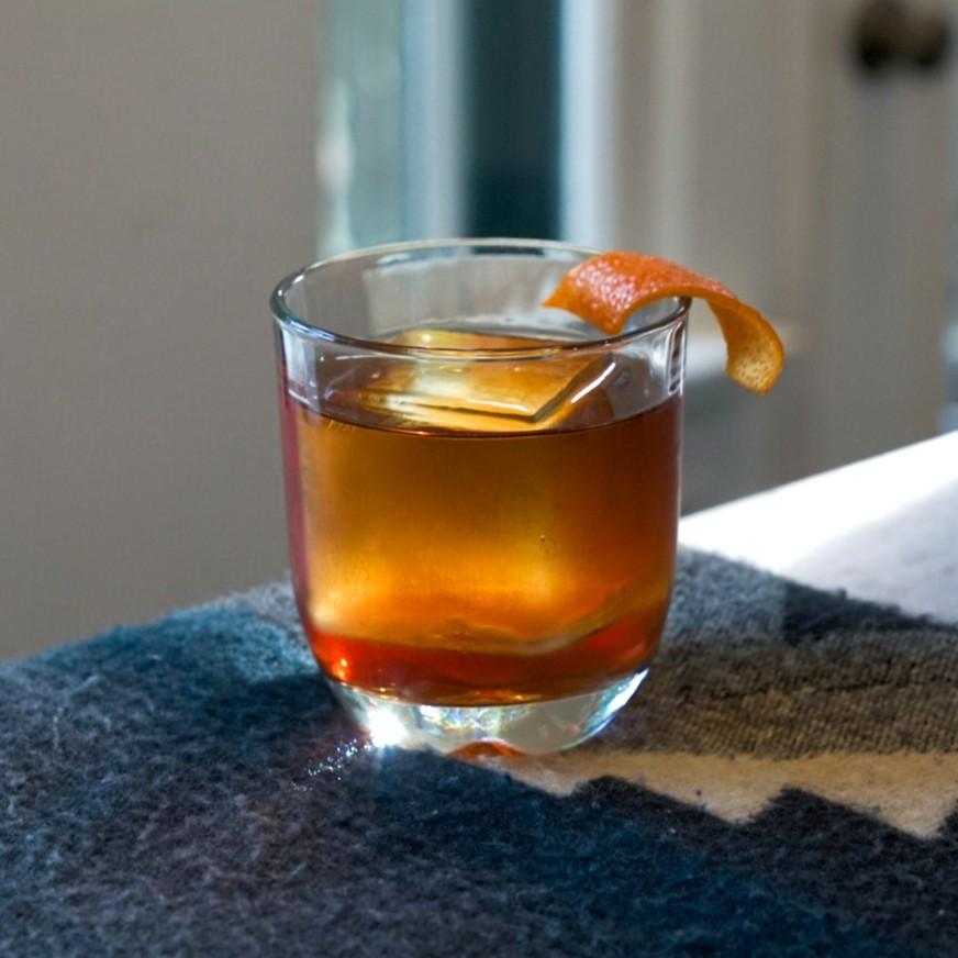 An example of the Beach Campfire, the mixed drink (drink) featuring brown rum, Meunier Cacao Noir Liqueur, and Amaro Sfumato Rabarbaro