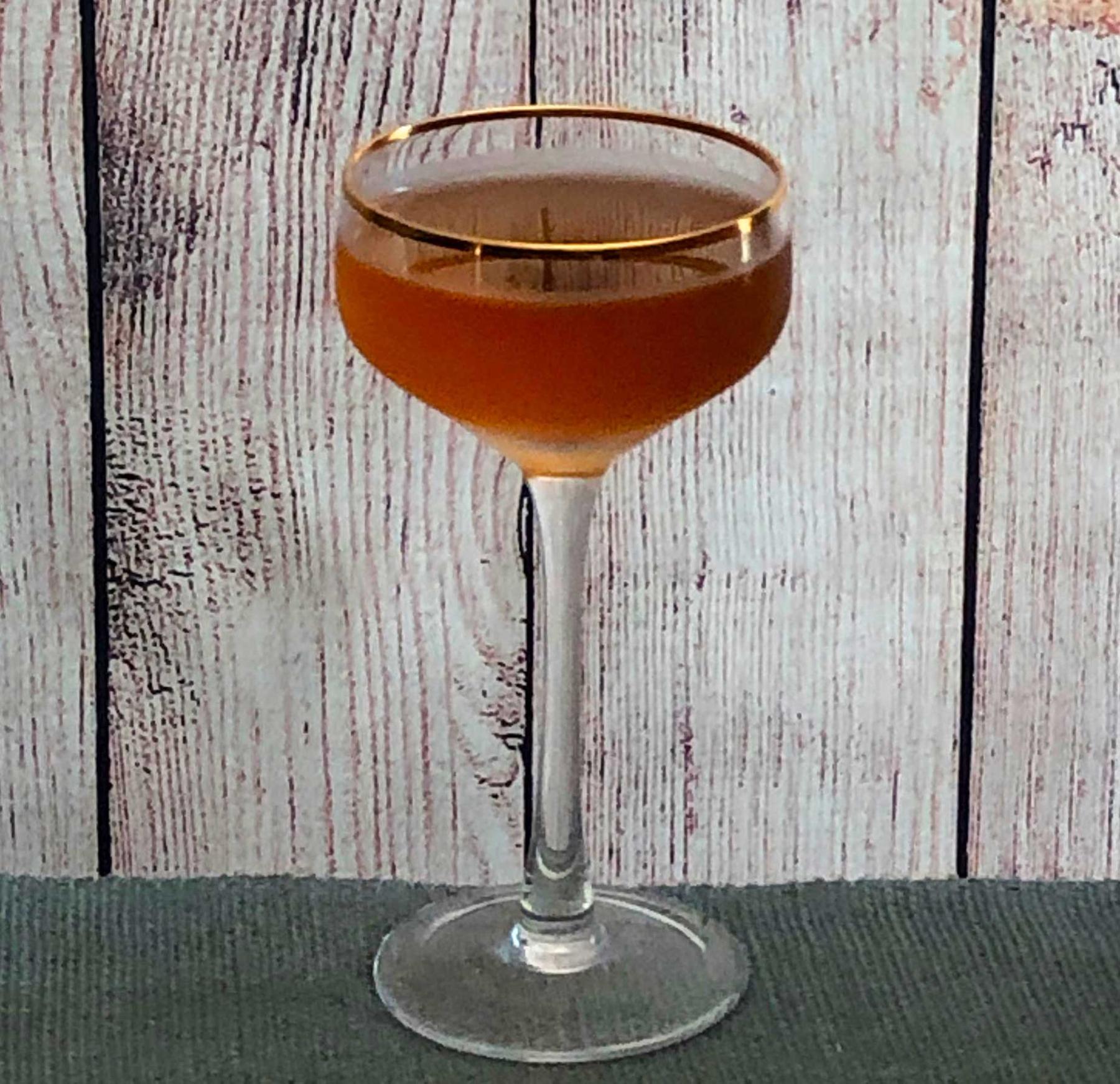 An example of the Club Cocktail, the mixed drink (drink), by The Only William, “Flowing Bowl”, featuring Hayman’s Old Tom Gin, Dolin Rouge Vermouth de Chambéry, simple syrup, Dolin Génépy le Chamois Liqueur, and orange bitters; photo by Lee Edwards