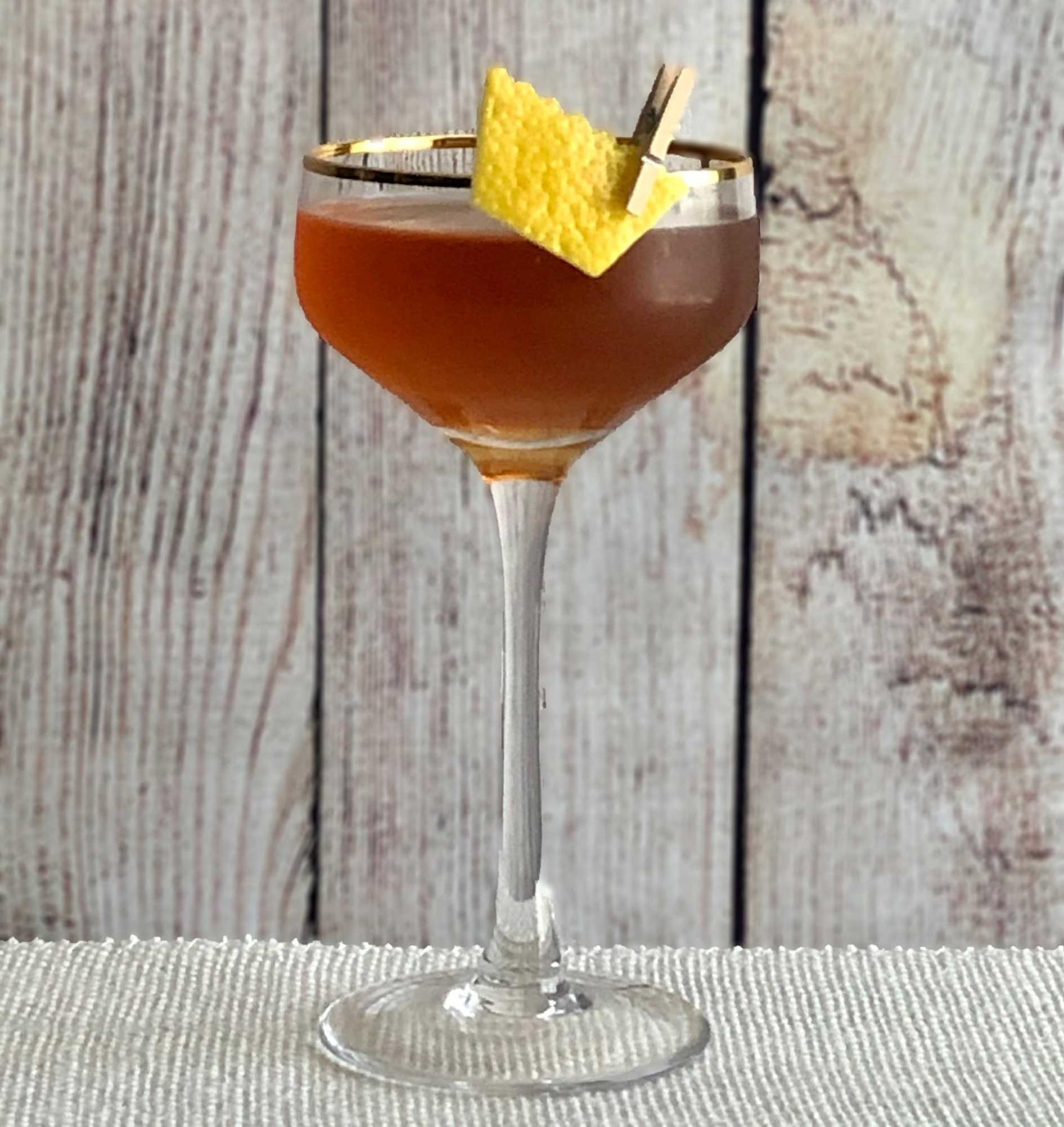 An example of the Return of the King, the mixed drink (drink), by John Filby, Augustine, NYC, featuring blended grain scotch, Pasubio Vino Amaro, Carpano Punt e Mes, and lemon twist; photo by Lee Edwards