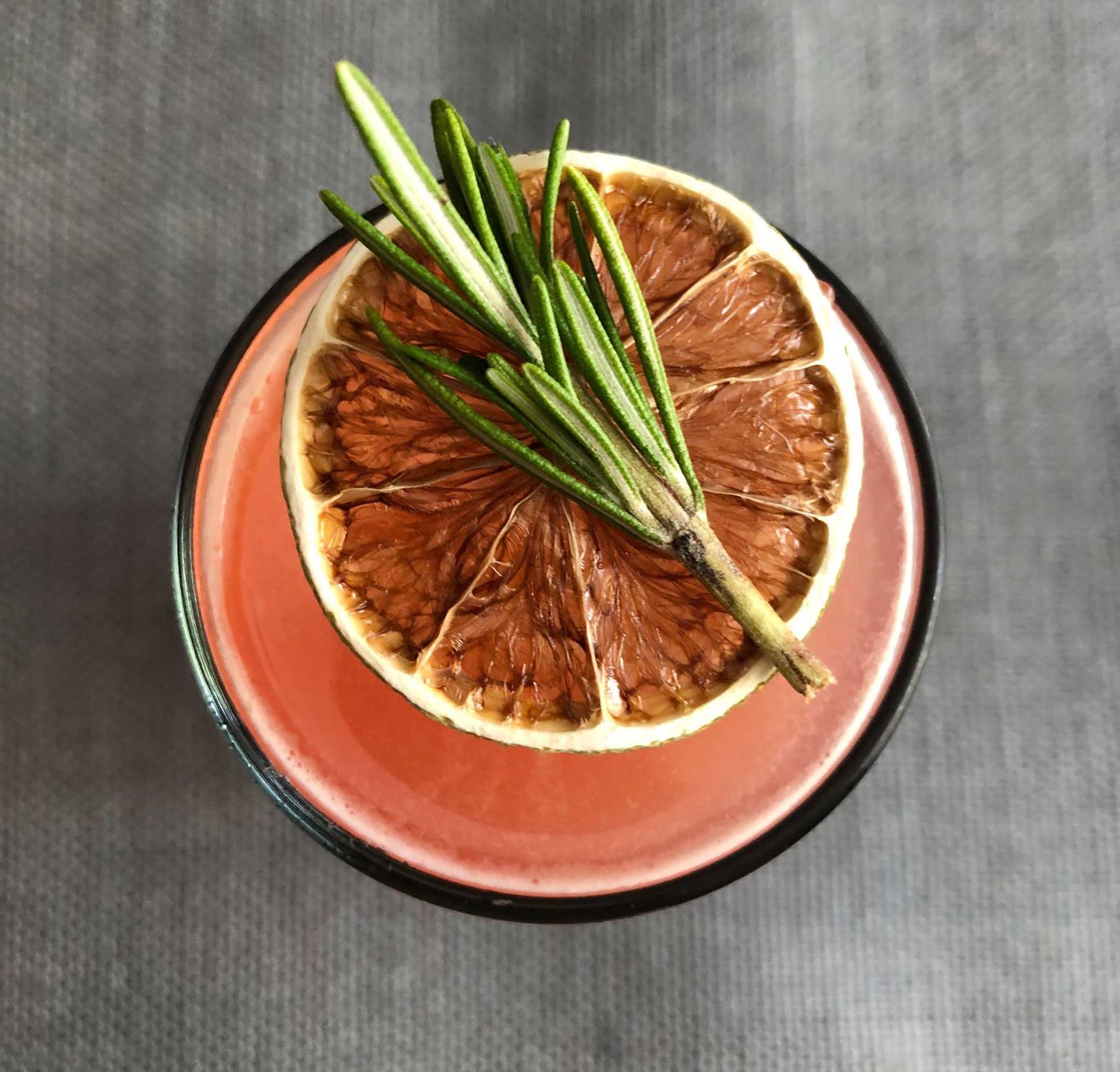 An example of the Altstadt Collins, the mixed drink (drink), by Adam Bernbach, 2Birds 1Stone, DC, featuring lager, Zirbenz Stone Pine Liqueur of the Alps, John D. Taylor’s Velvet Falernum, lime juice, sprig of rosemary, and lime wheel; photo by Lee Edwards