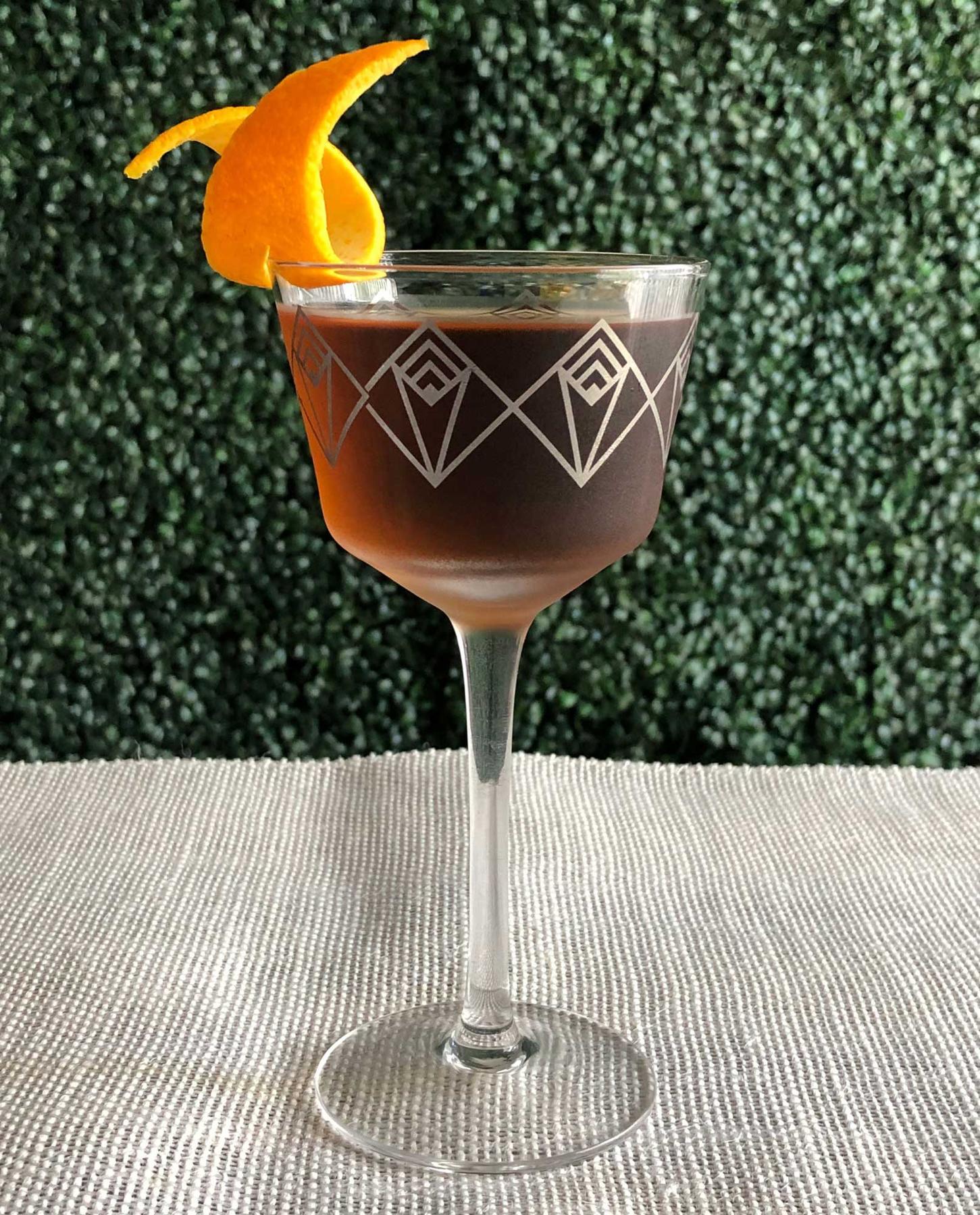 An example of the Bonal Martinez, the mixed drink (drink) featuring Hayman’s Old Tom Gin, Bonal Gentiane-Quina, maraschino liqueur, and orange twist; photo by Lee Edwards