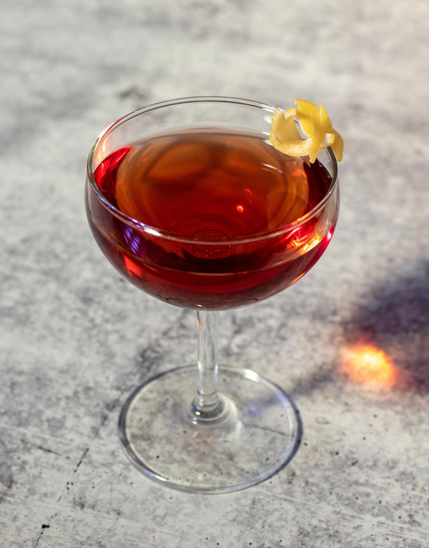 An example of the The Prime Directive no. 1, the mixed drink (drink) featuring Timbal Vermut de Reus Extra Dry, Salers Gentian Apéritif, Byrrh Grand Quinquina, and lemon twist; photo by Boon and Caro Sheridan